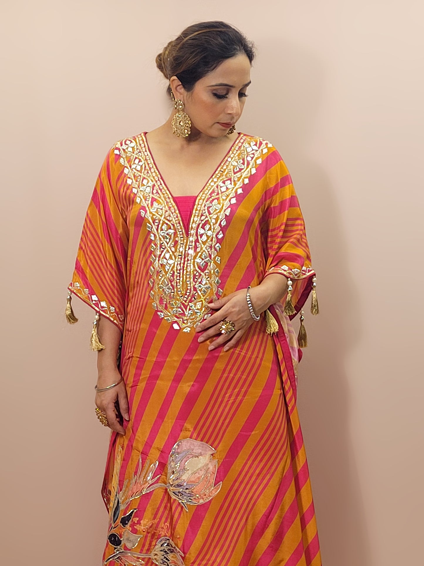 Orange Rani Kaftan with Pants. Gota and Applique work.
