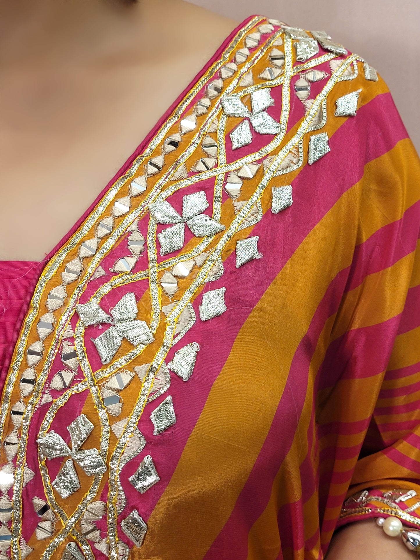 Orange Rani Kaftan with Pants. Gota and Applique work.