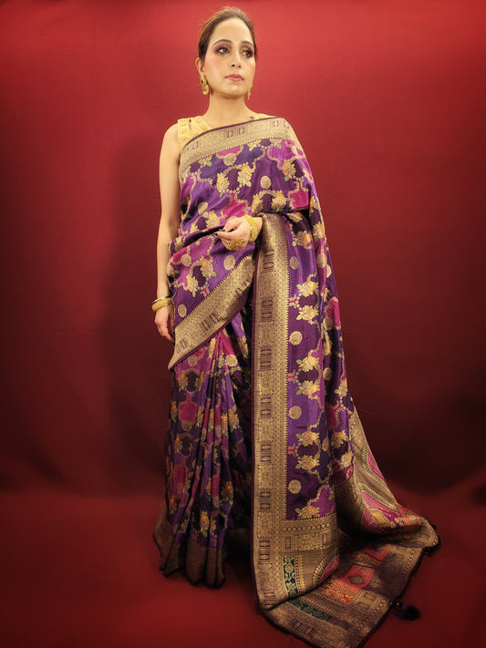 Envision a purple and pink multi-color woven saree, its silk fabric boasting a unique position print, a vibrant choice for both party and reception wear.