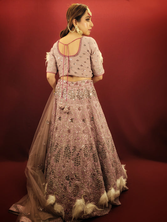 Discover the elegance of engagement & reception wear with our onion pink georgette attire, exquisitely embellished with applique fur work, threads, and mirrors for a breathtaking celebration.