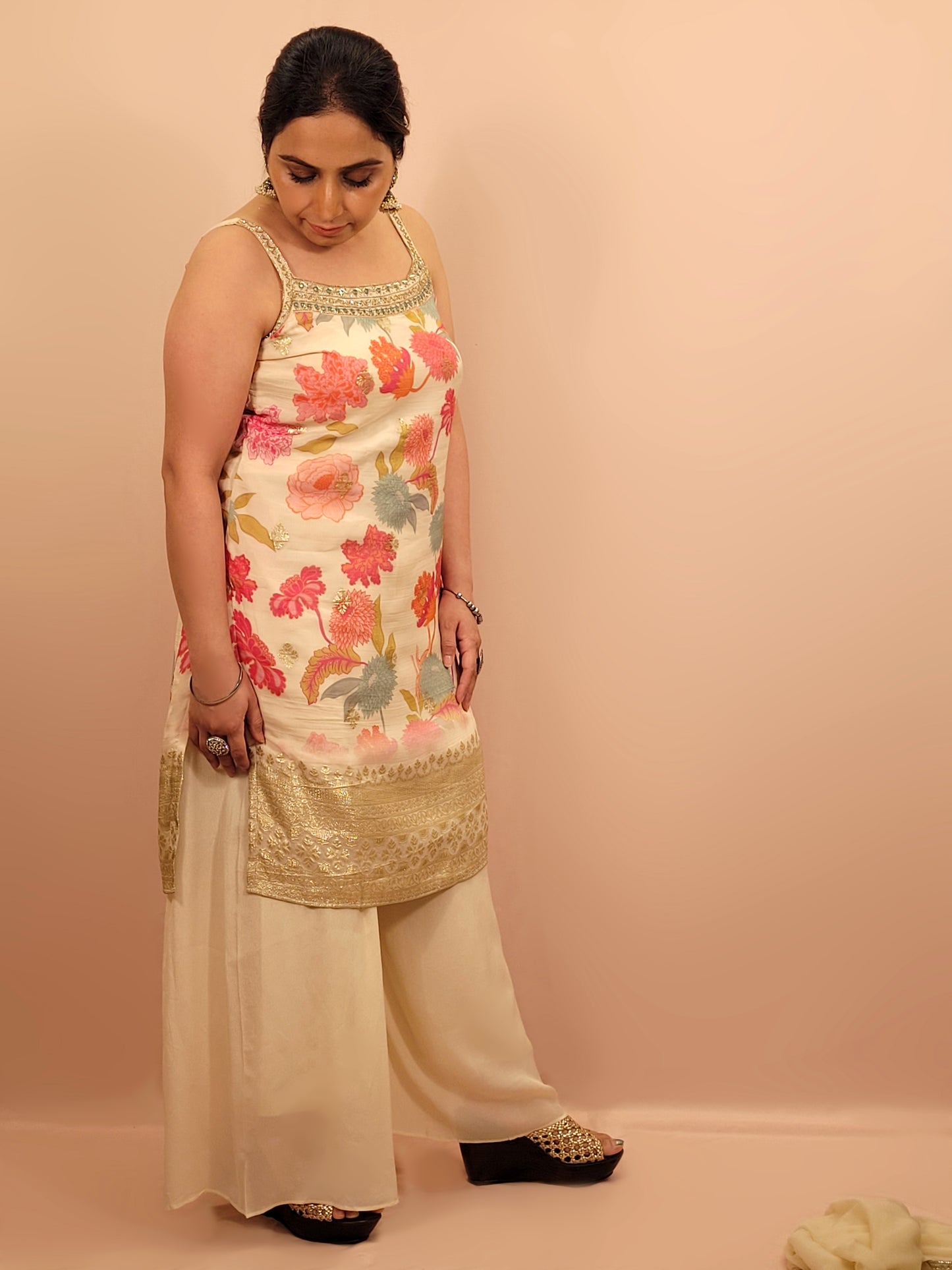 Creme chinon floral print kurti palazzo set. Cutdana, zarkan and dabka work.