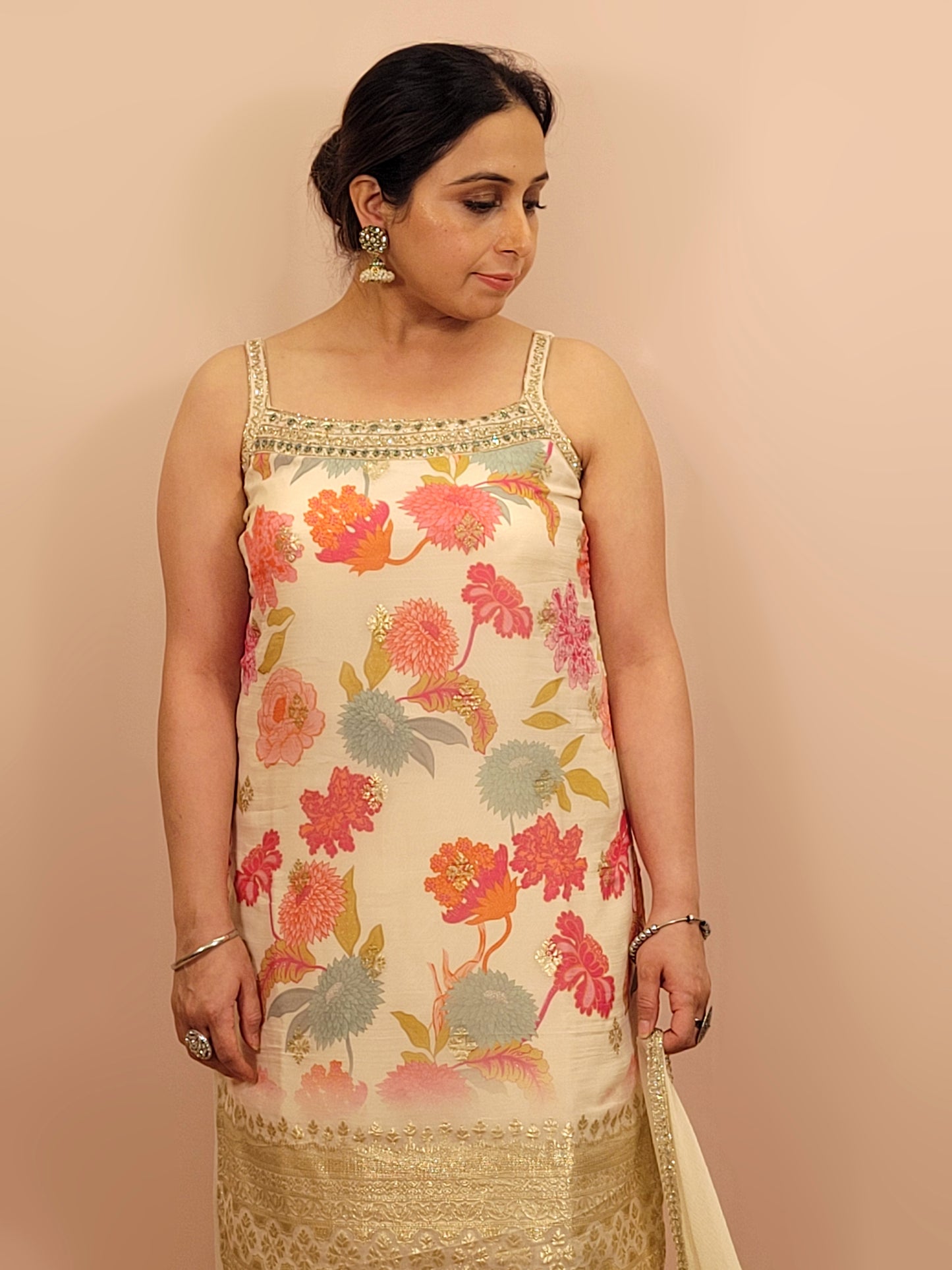Creme chinon floral print kurti palazzo set. Cutdana, zarkan and dabka work.