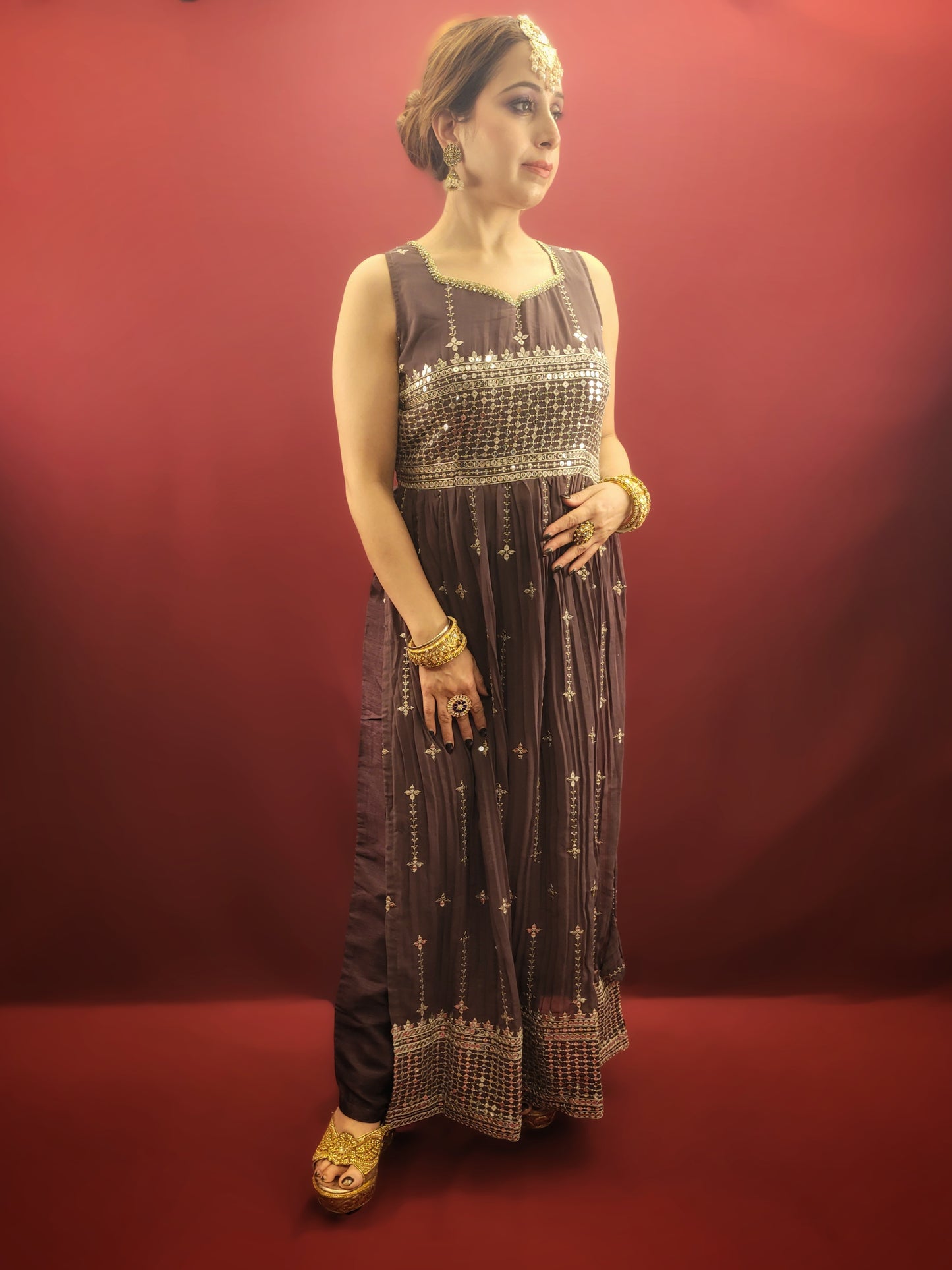 Step into a world of traditional charm with an antique fuchsia Nayra Kameez Pant Set, featuring a sparkle of sequins work, perfect for any ethnic fusion wardrobe.