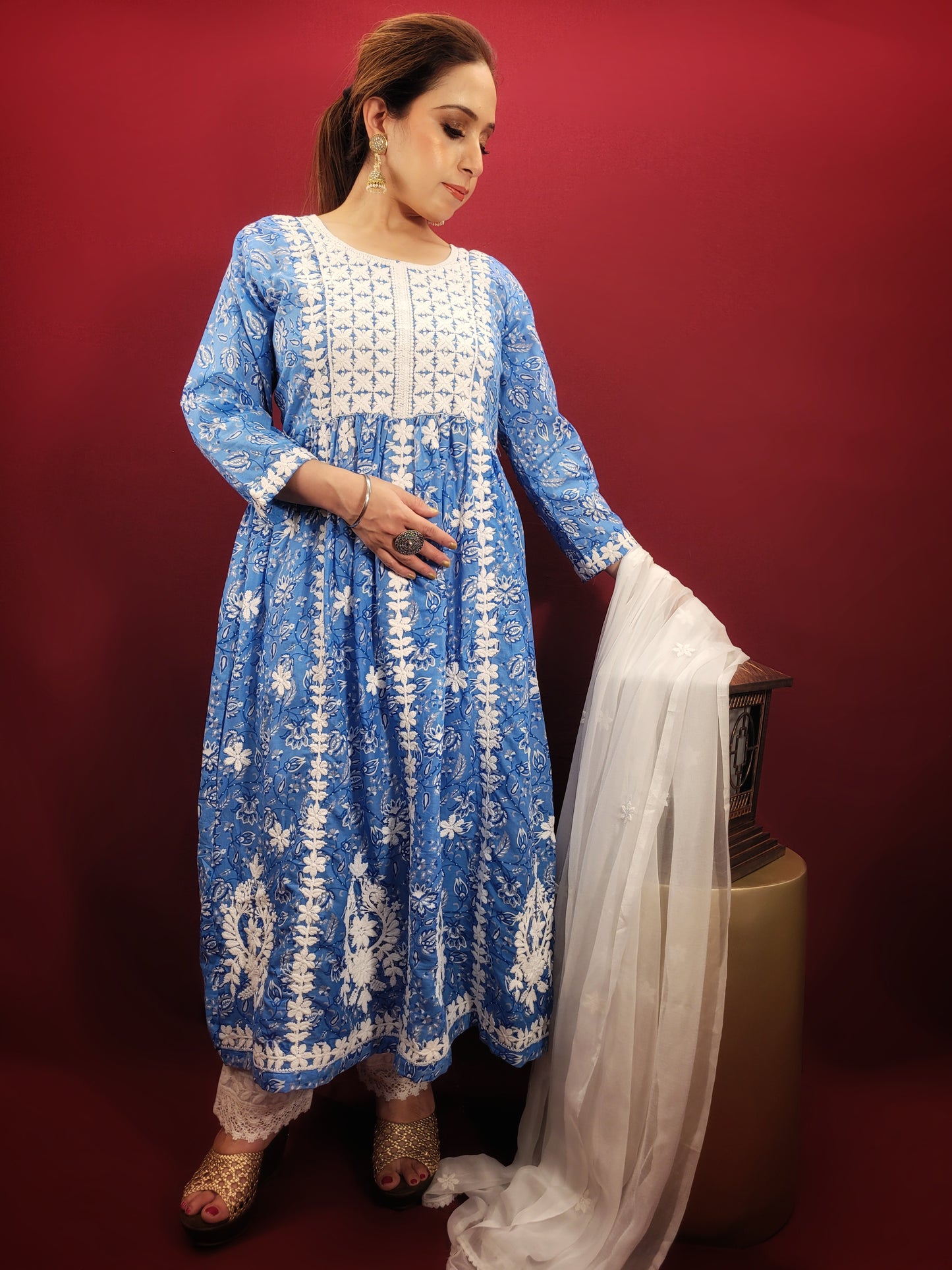 Embrace effortless style with the Floral Chikankari Anarkali Kurti Set, a versatile piece that transitions seamlessly from casual outings to office wear and summer parties. The stunning blue cotton base is adorned with a delicate floral print, further accentuated by intricate chikankari embroidery.