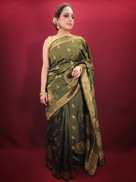 Looking for a stunning piece of clothing that will make you stand out at any festive occasion or mehendi ceremony? Look no further than this beautiful silk saree, expertly crafted with intricate woven work and cutdana bead detailing that catches the light and adds a touch of glamour to any outfit.