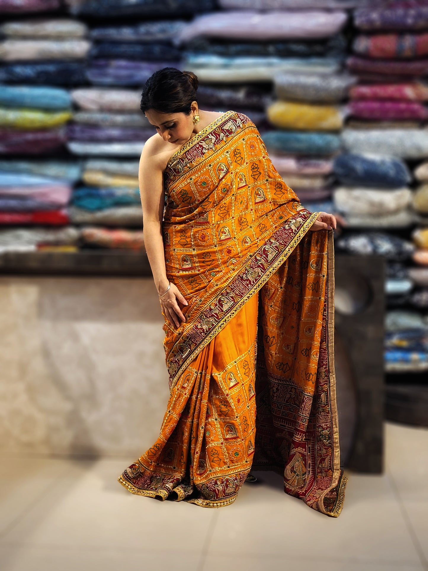 This beautiful mustard yellow silk saree with a beautiful maroon pallu that makes it stand out from the crowd. The saree features intricate cutdana, zari, and thread work that gives it a touch of elegance and class. This saree is perfect for any party, wedding, or even as a bridal wear.