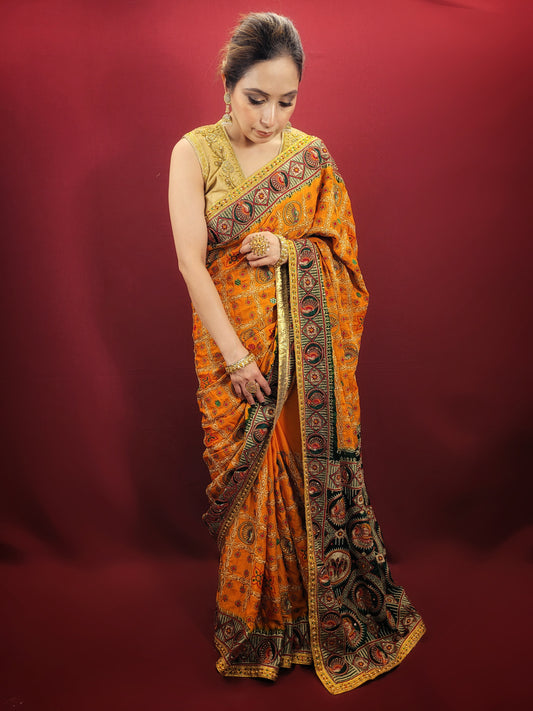 This gorgeous mustard yellow gajji silk saree with a beautiful green pallu that makes it stand out from the crowd. The saree features intricate cutdana, zari, and thread work that gives it a touch of elegance and class. This saree is perfect for any party, wedding, or even as a bridal wear.