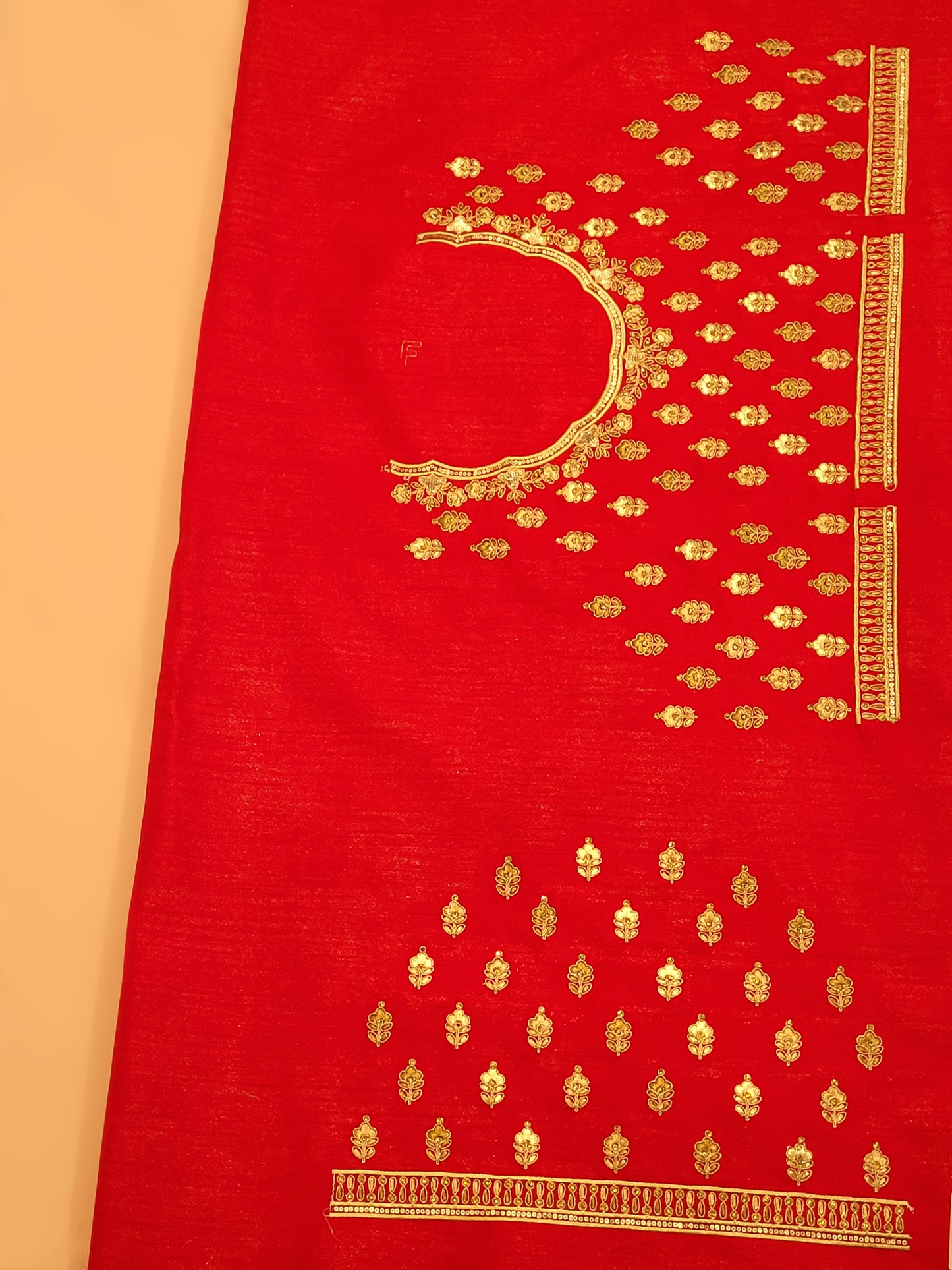 Elevate your wedding attire with this luxurious silk lehenga. Adorned with intricate gota patti work, this stunning red lehenga exudes elegance and sophistication. Accompanied by a matching heavy net dupatta, it is the perfect choice for a grand celebration.