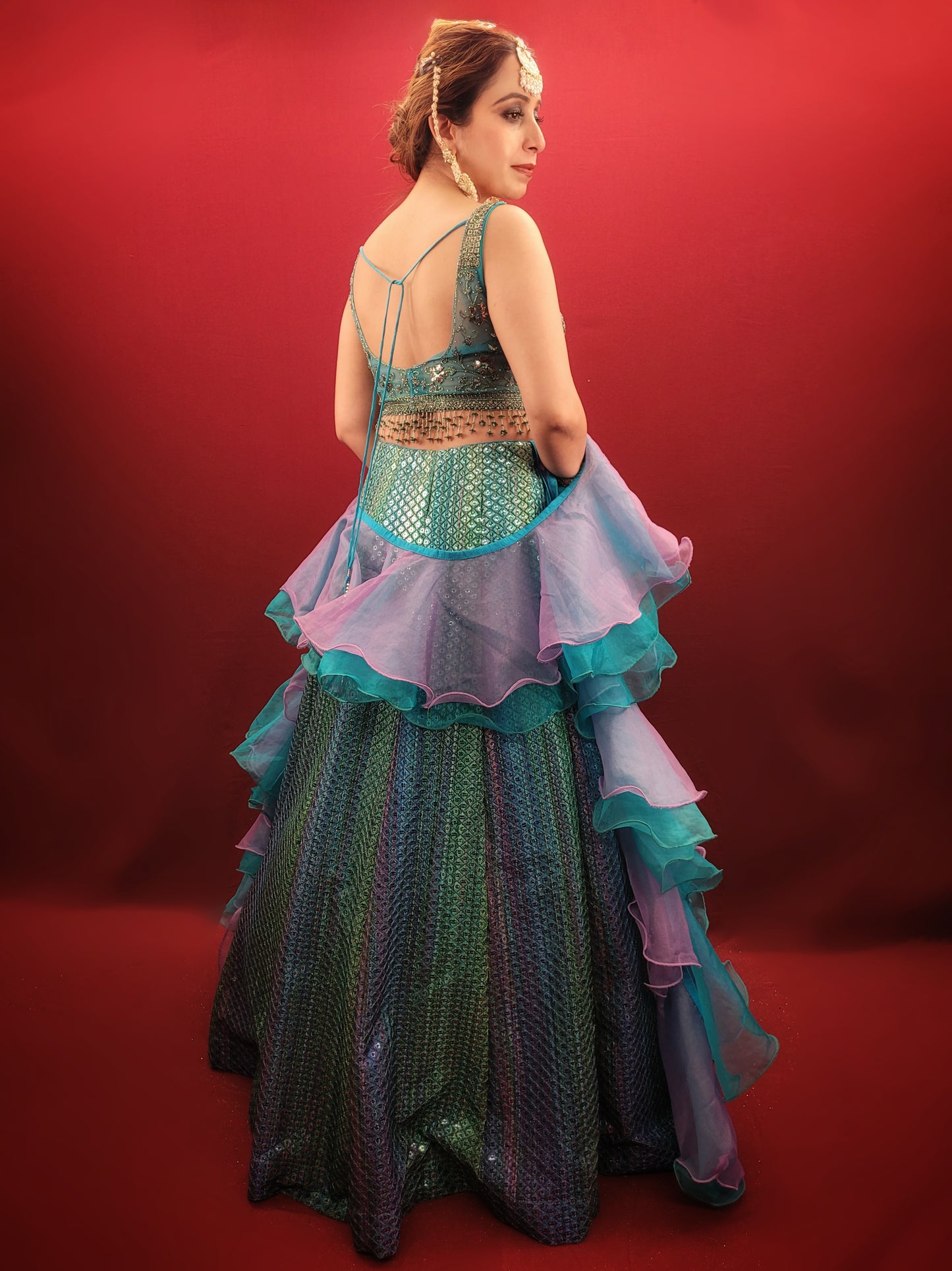 Introducing our stunning Shaded Teal Blue Lehenga Choli - the perfect choice for your upcoming special occasions. This exquisite ensemble features intricate beadwork, zardozi, and sequins on the choli, adding a touch of glamour and elegance to your overall look. Made from high-quality imported fabric, the lehenga choli is not only stylish but also comfortable to wear.
