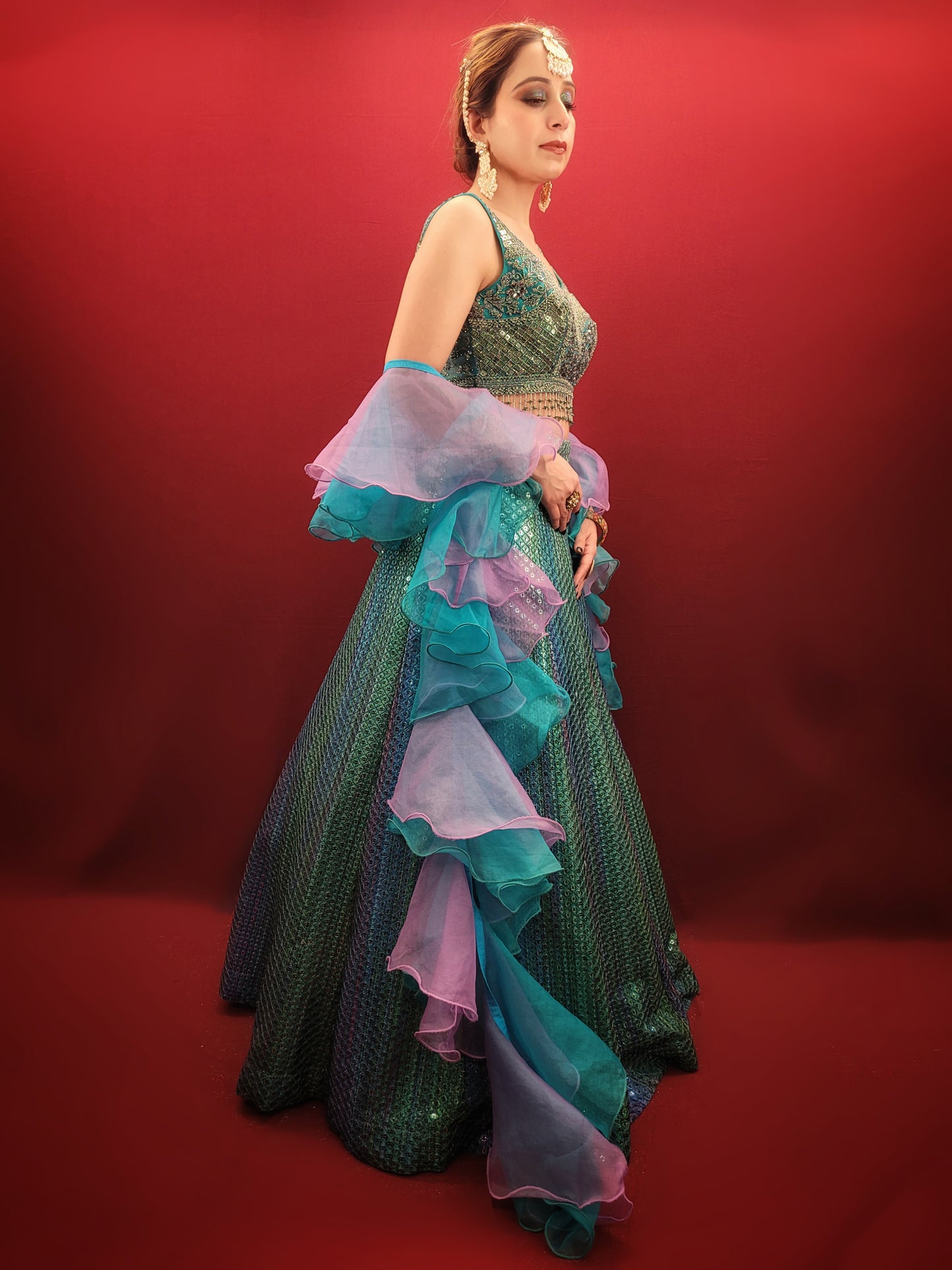 Introducing our stunning Shaded Teal Blue Lehenga Choli - the perfect choice for your upcoming special occasions. This exquisite ensemble features intricate beadwork, zardozi, and sequins on the choli, adding a touch of glamour and elegance to your overall look. Made from high-quality imported fabric, the lehenga choli is not only stylish but also comfortable to wear.