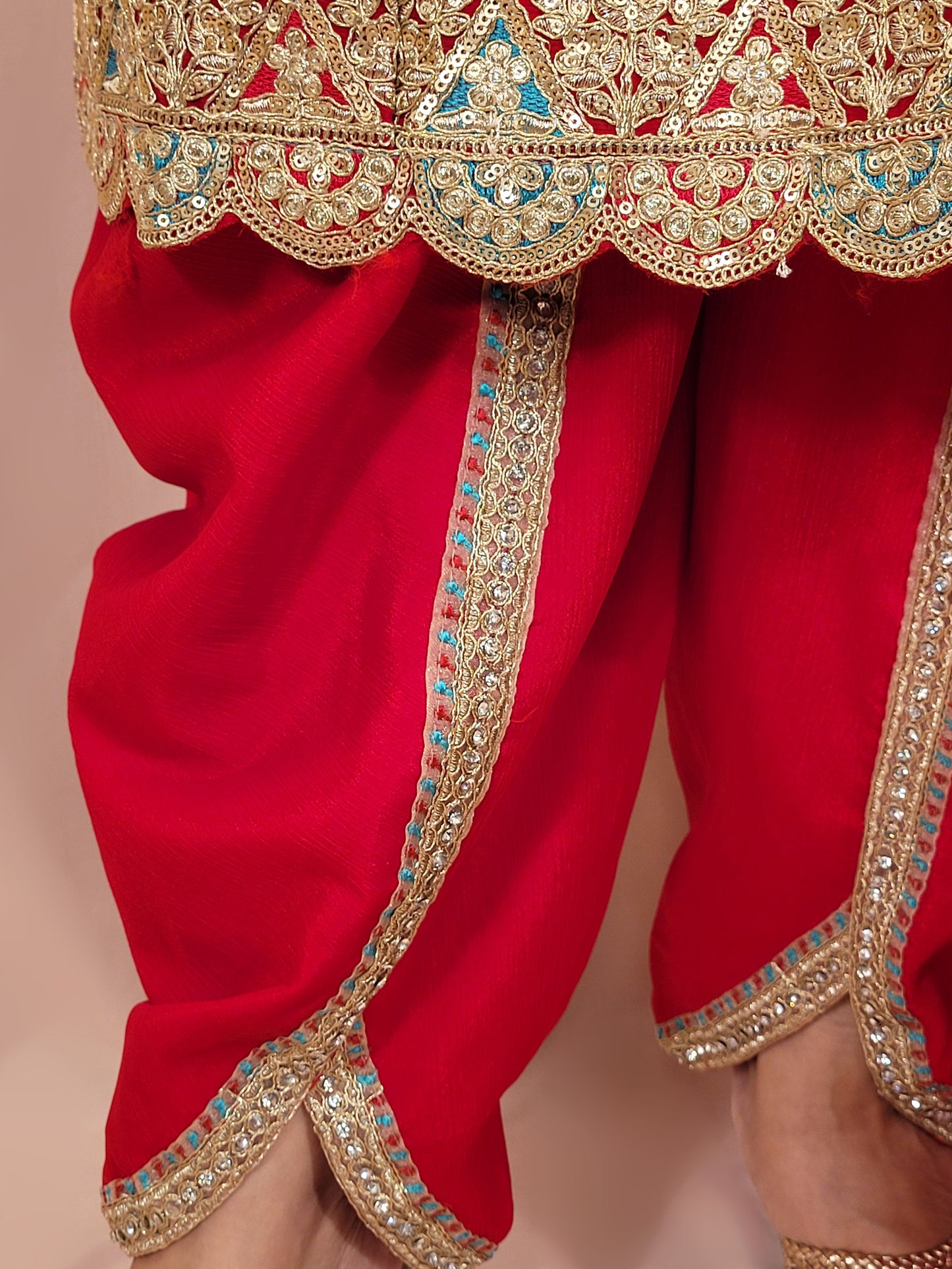 Red Chinnon Anarkali with matching Tulip Pants. Contrast neck yolk with resham, zari and sequins. Contrast Dupatta. Latest trend in Indian ethnic fusion wear.