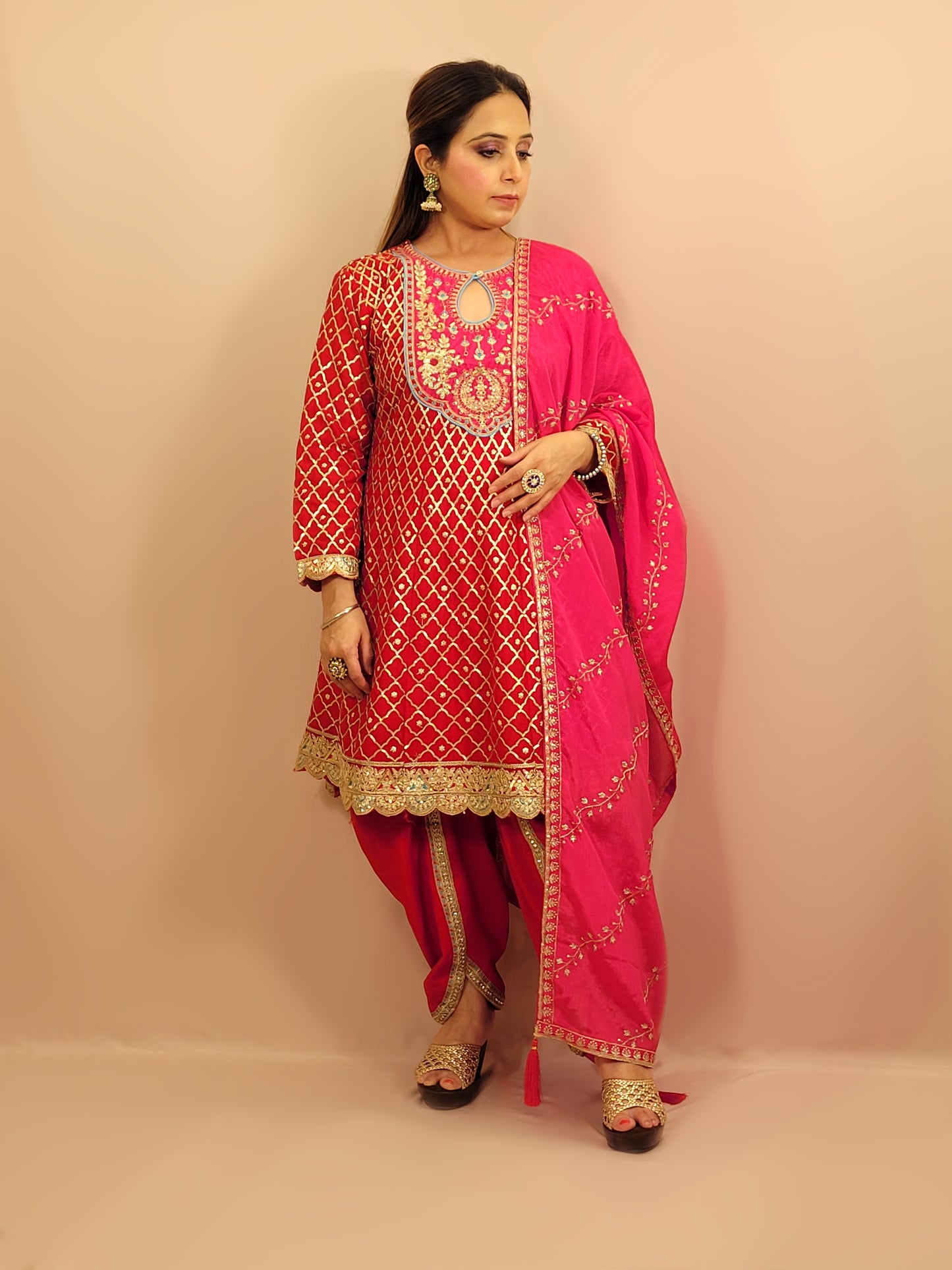 Red Chinnon Anarkali with matching Tulip Pants. Contrast neck yolk with resham, zari and sequins. Contrast Dupatta. Latest trend in Indian ethnic fusion wear.