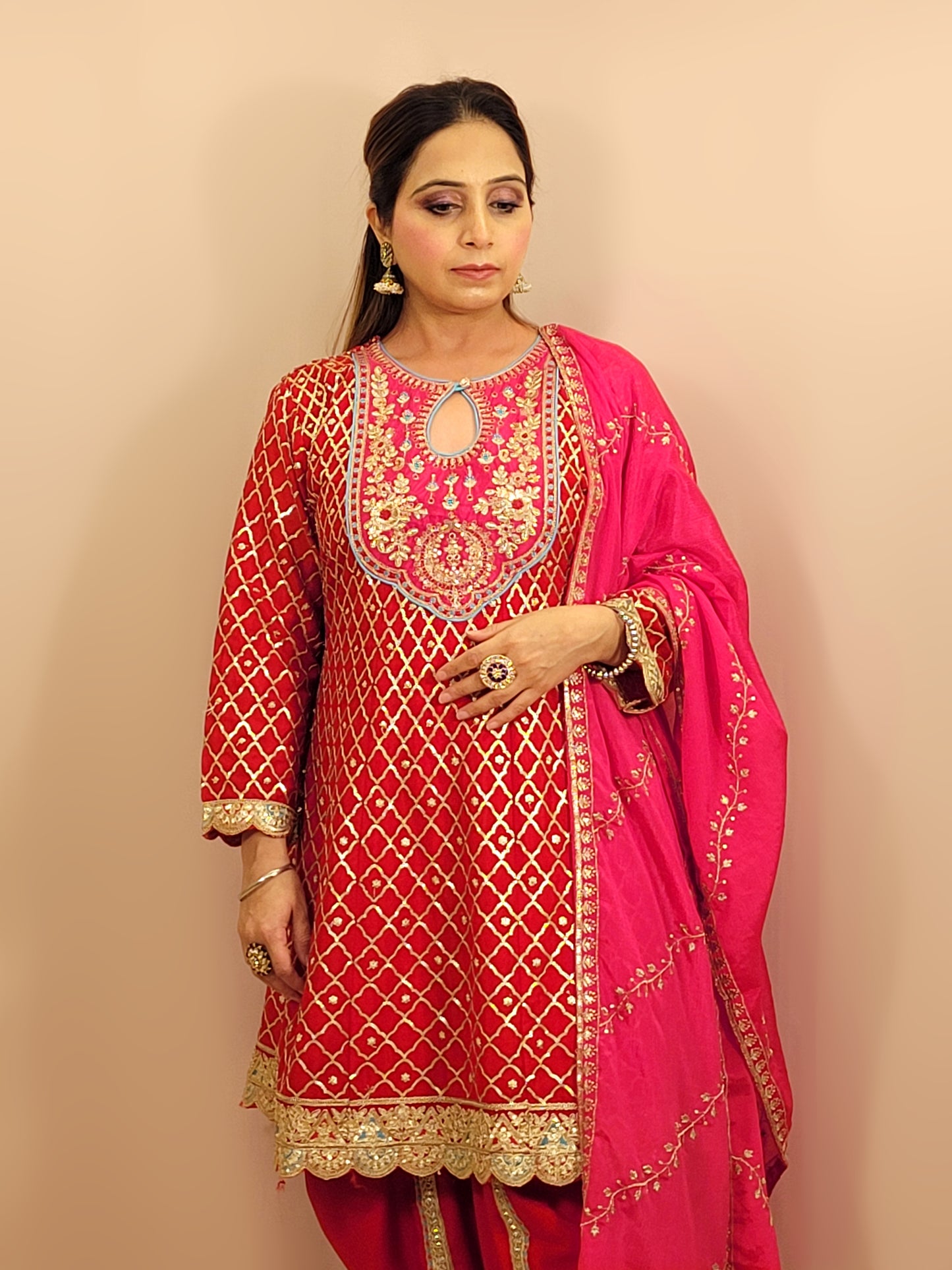 Red Chinnon Anarkali with matching Tulip Pants. Contrast neck yolk with resham, zari and sequins. Contrast Dupatta. Latest trend in Indian ethnic fusion wear.
