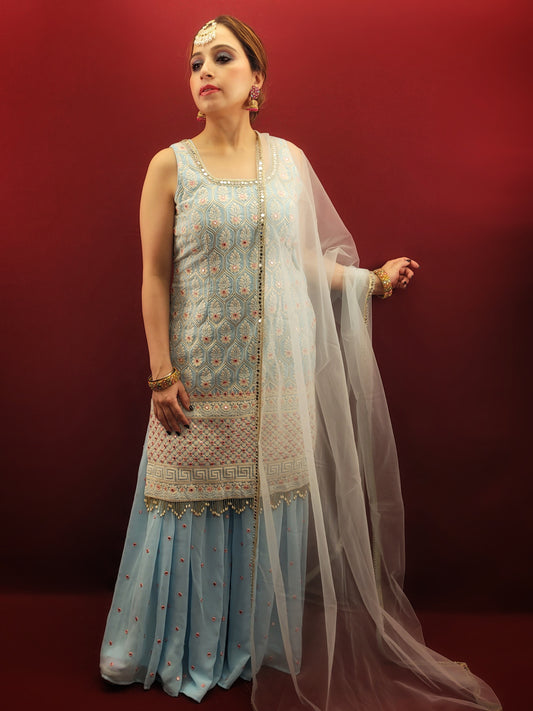 Beguile in breathtaking beauty with this light sky blue georgette gharara suit. The luxurious fabric cascades down your figure, creating a silhouette that's both soft and graceful. The true star of the show, however, is the exquisite embellishment.