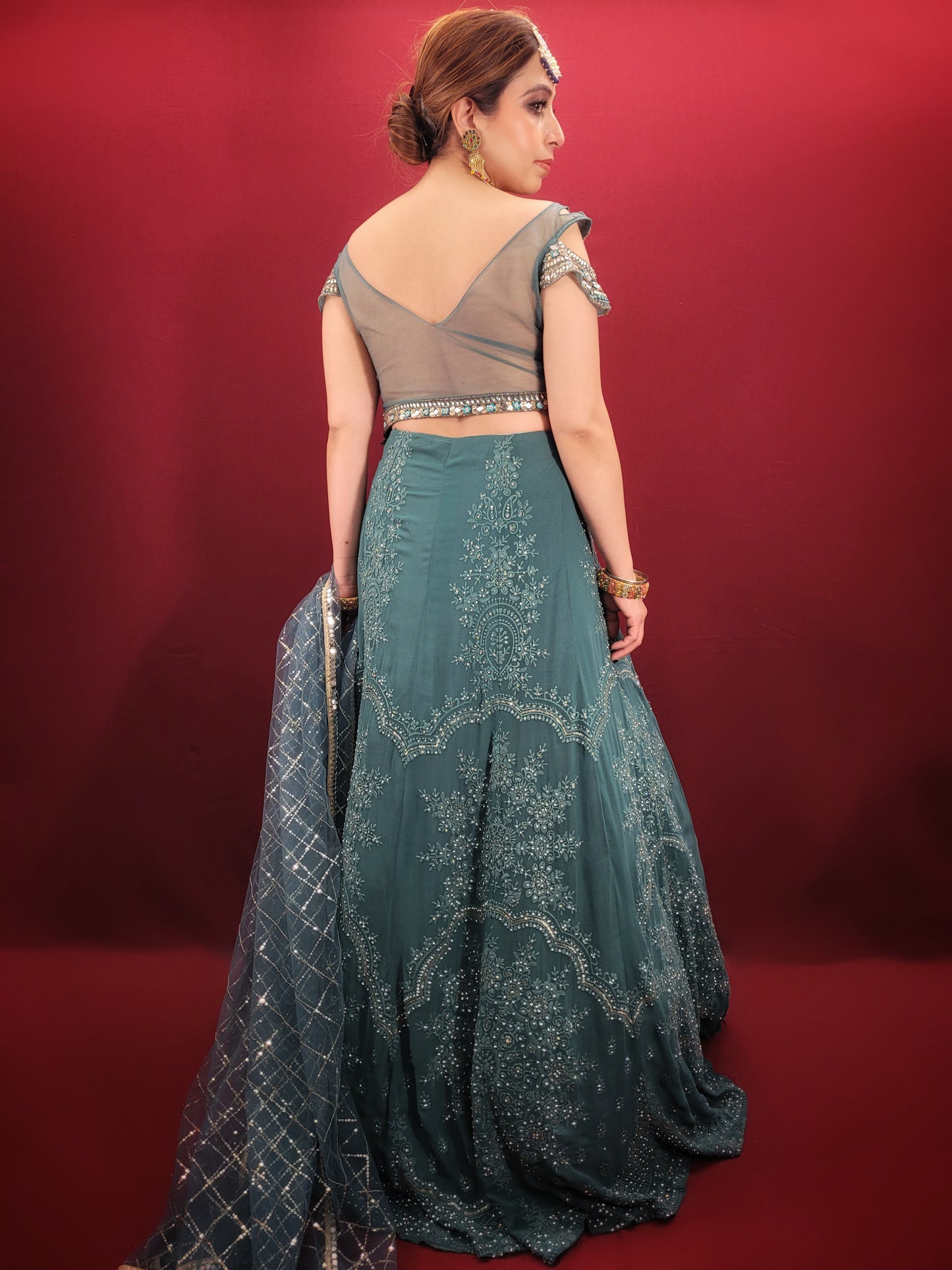 Immerse yourself in captivating elegance with this Ready-to-Wear Lehenga Choli Set in a mesmerizing Grand Canal Blue. Crafted from luxurious georgette fabric, this ensemble drapes effortlessly, ensuring a graceful silhouette and a touch of contemporary sophistication. Perfect for your engagement or any grand party, this outfit is sure to turn heads.