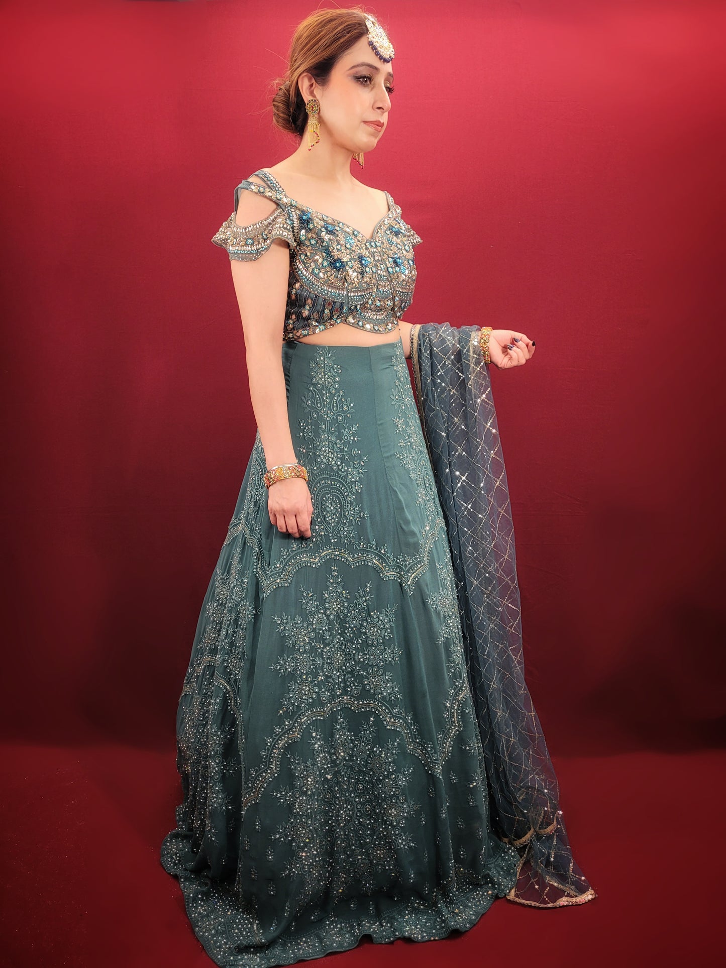 Immerse yourself in captivating elegance with this Ready-to-Wear Lehenga Choli Set in a mesmerizing Grand Canal Blue. Crafted from luxurious georgette fabric, this ensemble drapes effortlessly, ensuring a graceful silhouette and a touch of contemporary sophistication. Perfect for your engagement or any grand party, this outfit is sure to turn heads.