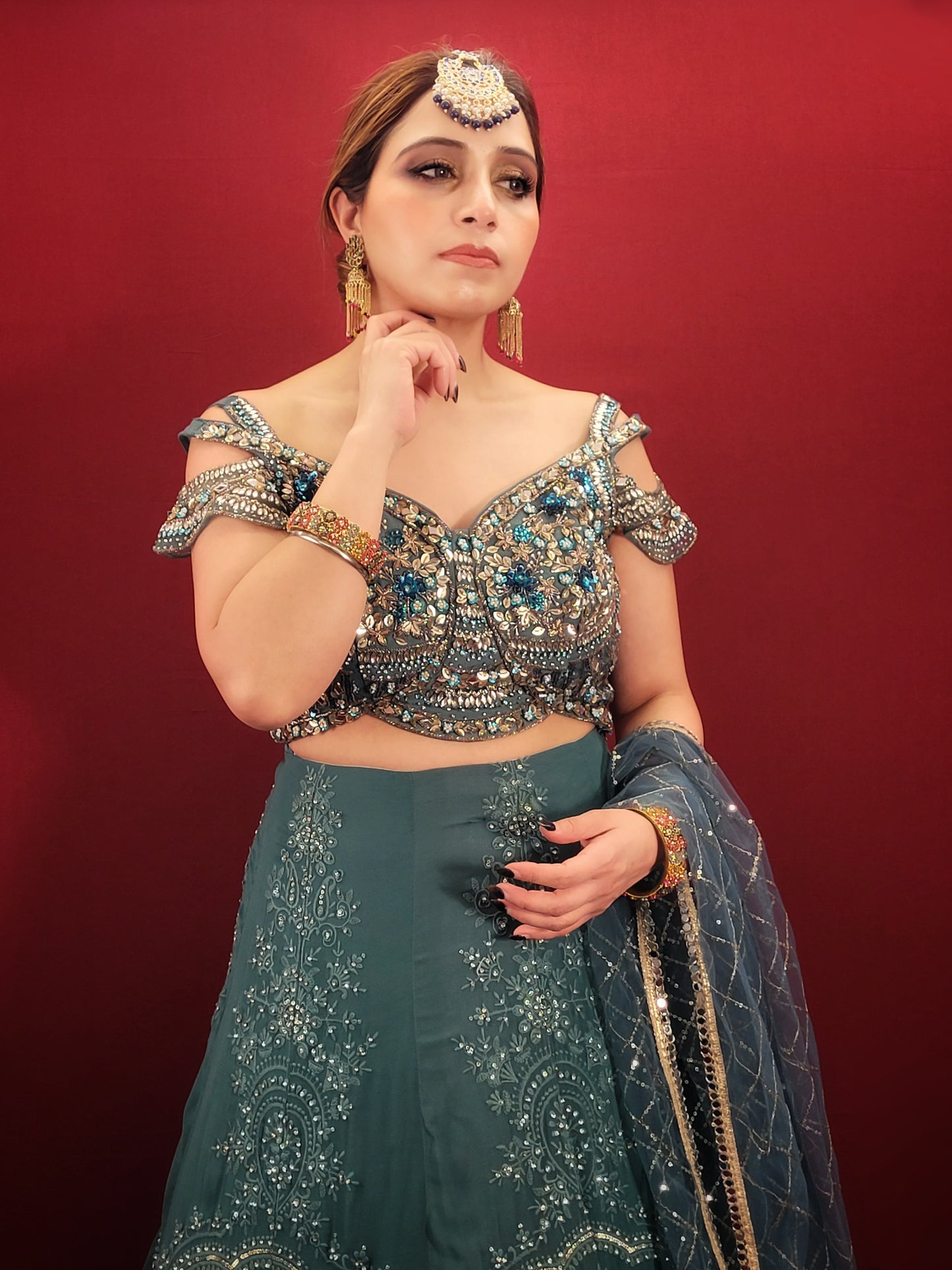 Immerse yourself in captivating elegance with this Ready-to-Wear Lehenga Choli Set in a mesmerizing Grand Canal Blue. Crafted from luxurious georgette fabric, this ensemble drapes effortlessly, ensuring a graceful silhouette and a touch of contemporary sophistication. Perfect for your engagement or any grand party, this outfit is sure to turn heads.