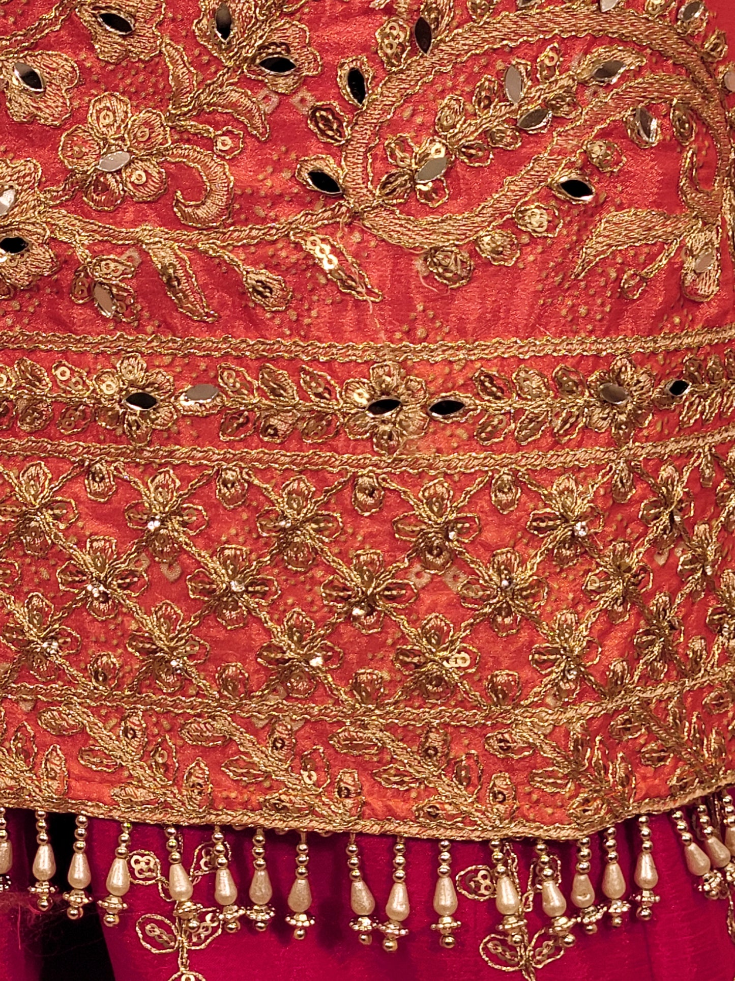 Rani Pink and Orange Shaded Kameez. Rani Sharara and Dupatta. Heavy Embroidery. Zari, Sequins and Mirror.