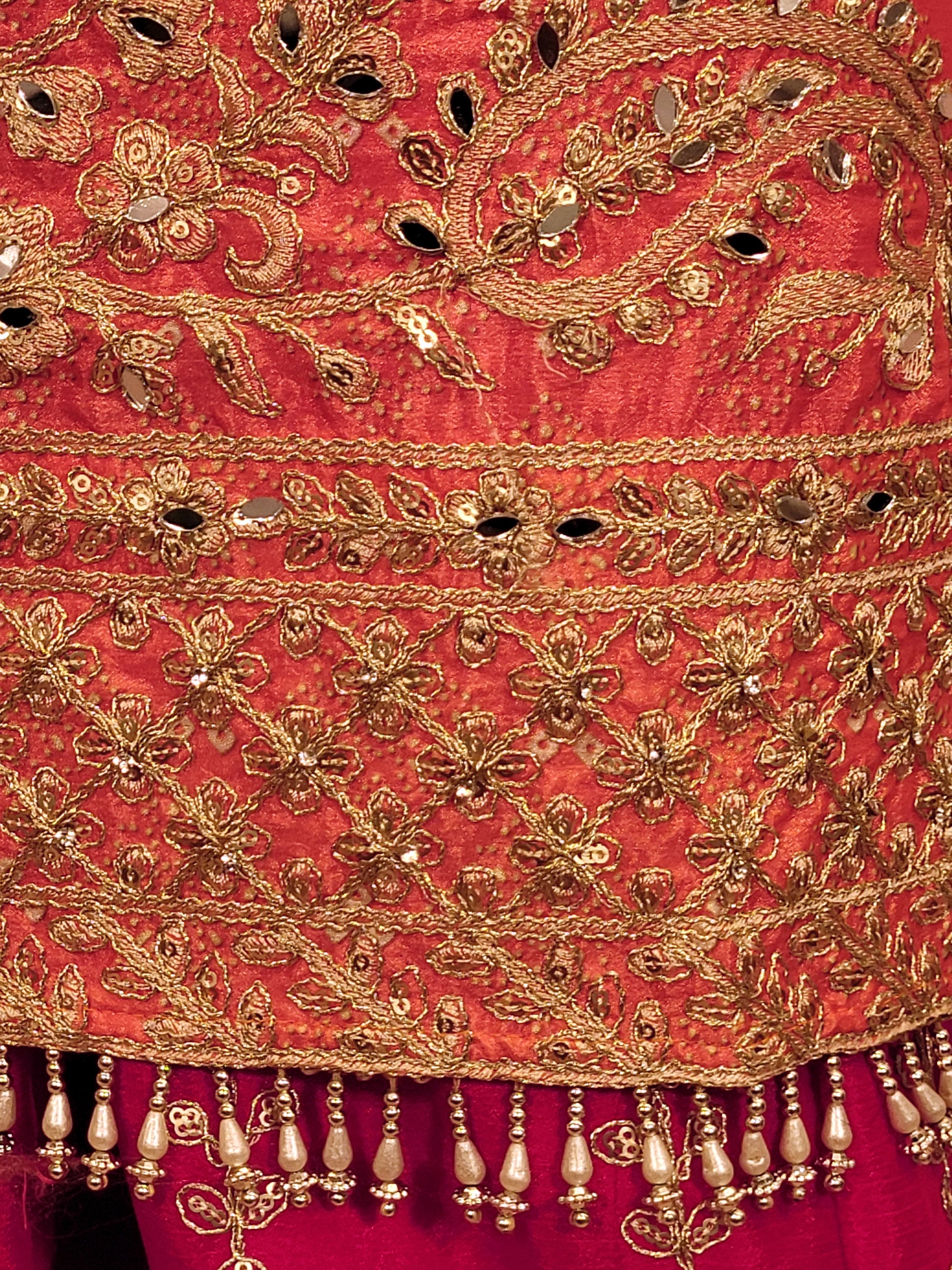 Rani Pink and Orange Shaded Kameez. Rani Sharara and Dupatta. Heavy Embroidery. Zari, Sequins and Mirror.