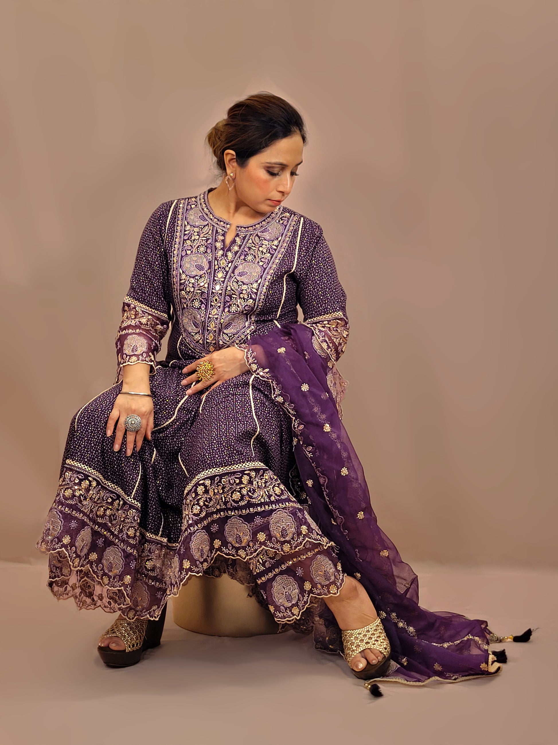 Rayon Purple Anarkali with Pant and Dupatta. Printed Base. Resham and Lace Work with sequins and mirror highlights.