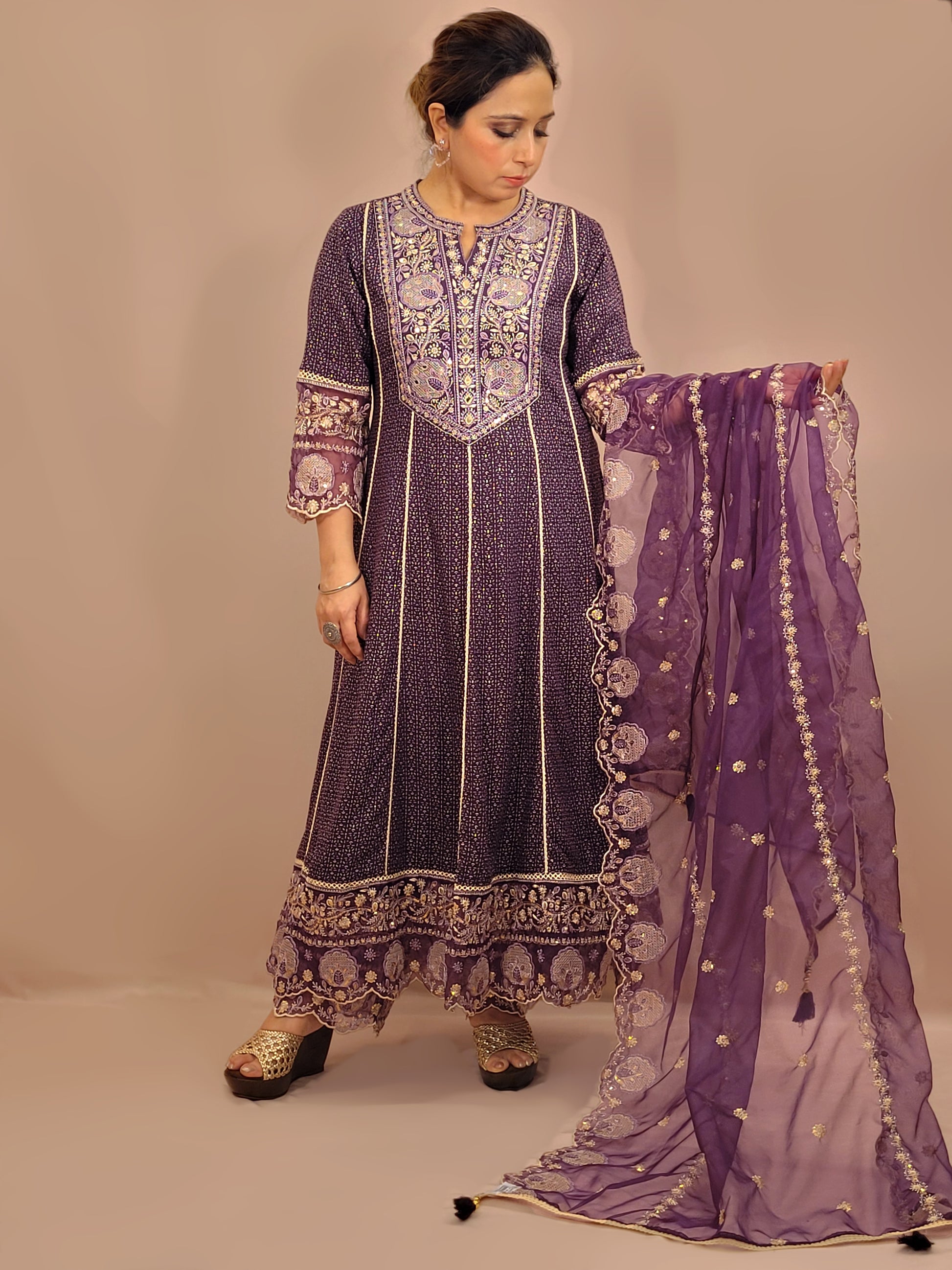 Rayon Purple Anarkali with Pant and Dupatta. Printed Base. Resham and Lace Work with sequins and mirror highlights.