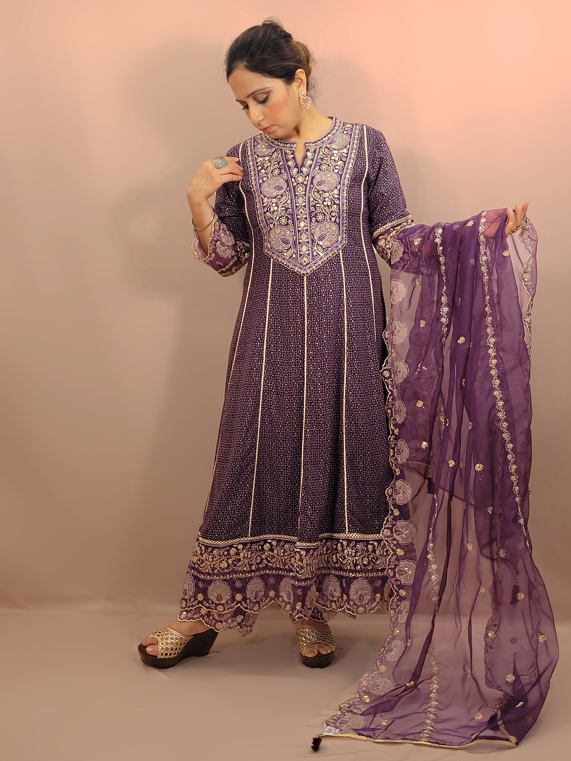 Rayon Purple Anarkali with Pant and Dupatta. Printed Base. Resham and Lace Work with sequins and mirror highlights.