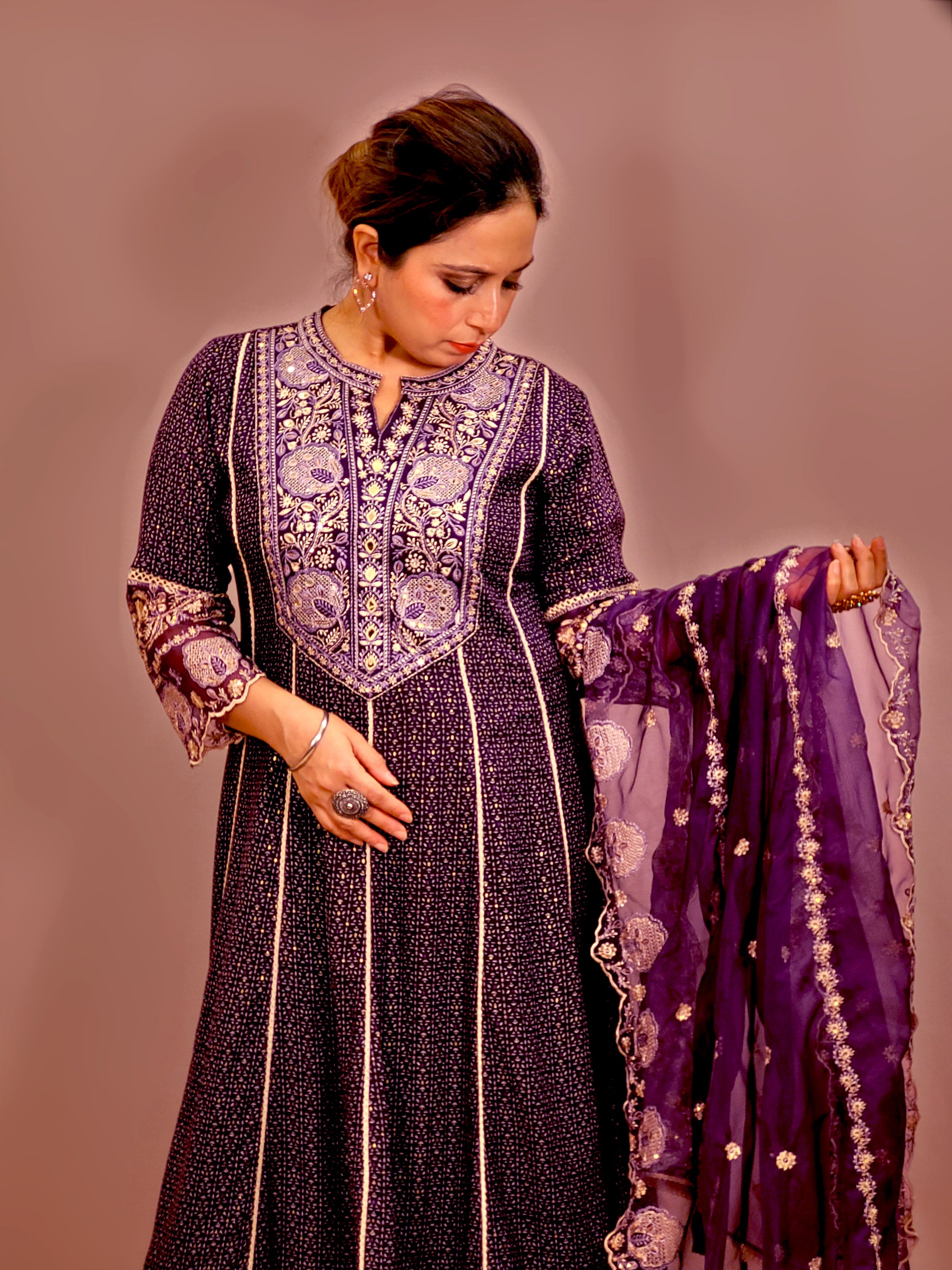 Rayon Purple Anarkali with Pant and Dupatta. Printed Base. Resham and Lace Work with sequins and mirror highlights.