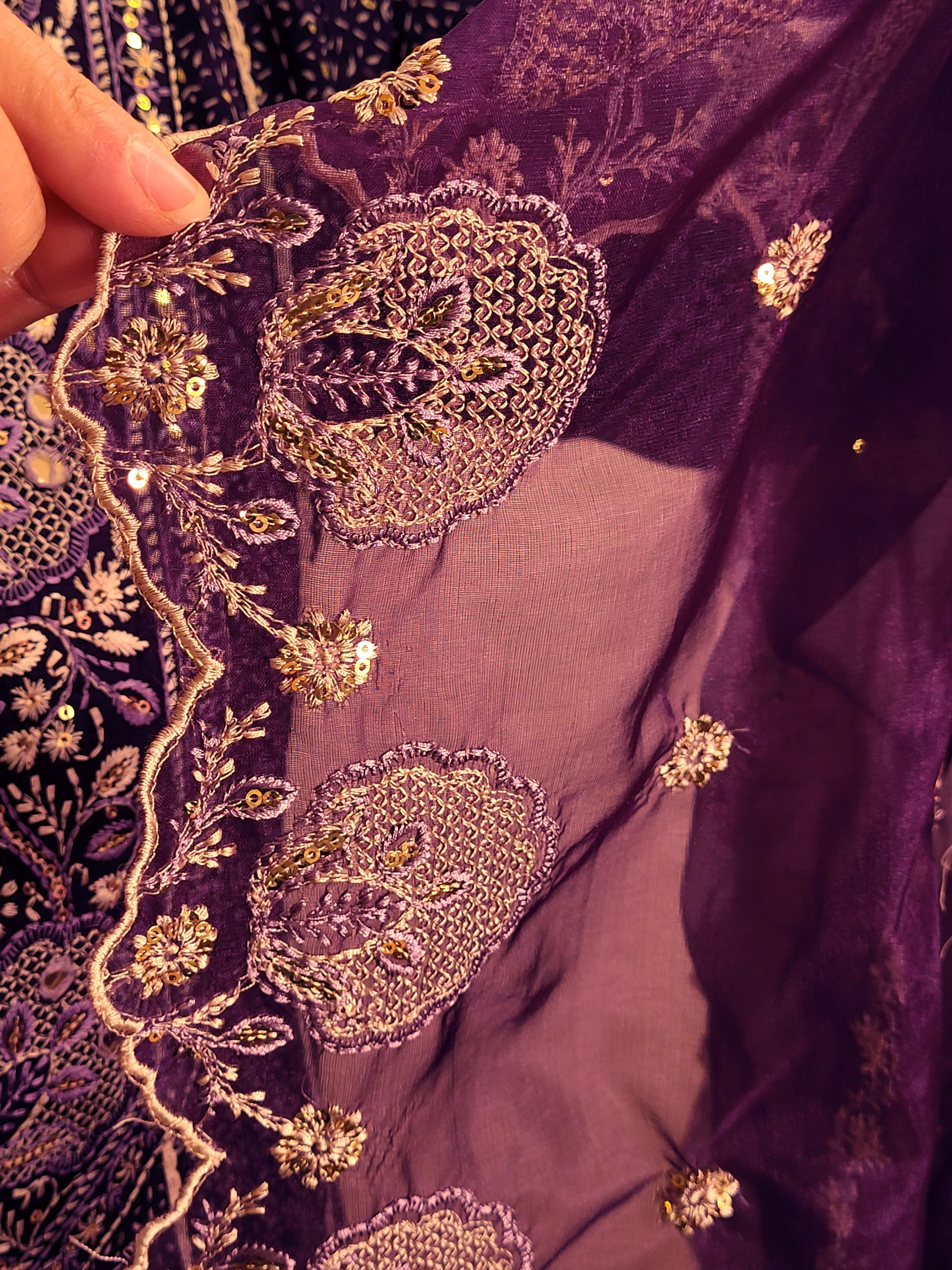 Rayon Purple Anarkali with Pant and Dupatta. Printed Base. Resham and Lace Work with sequins and mirror highlights.