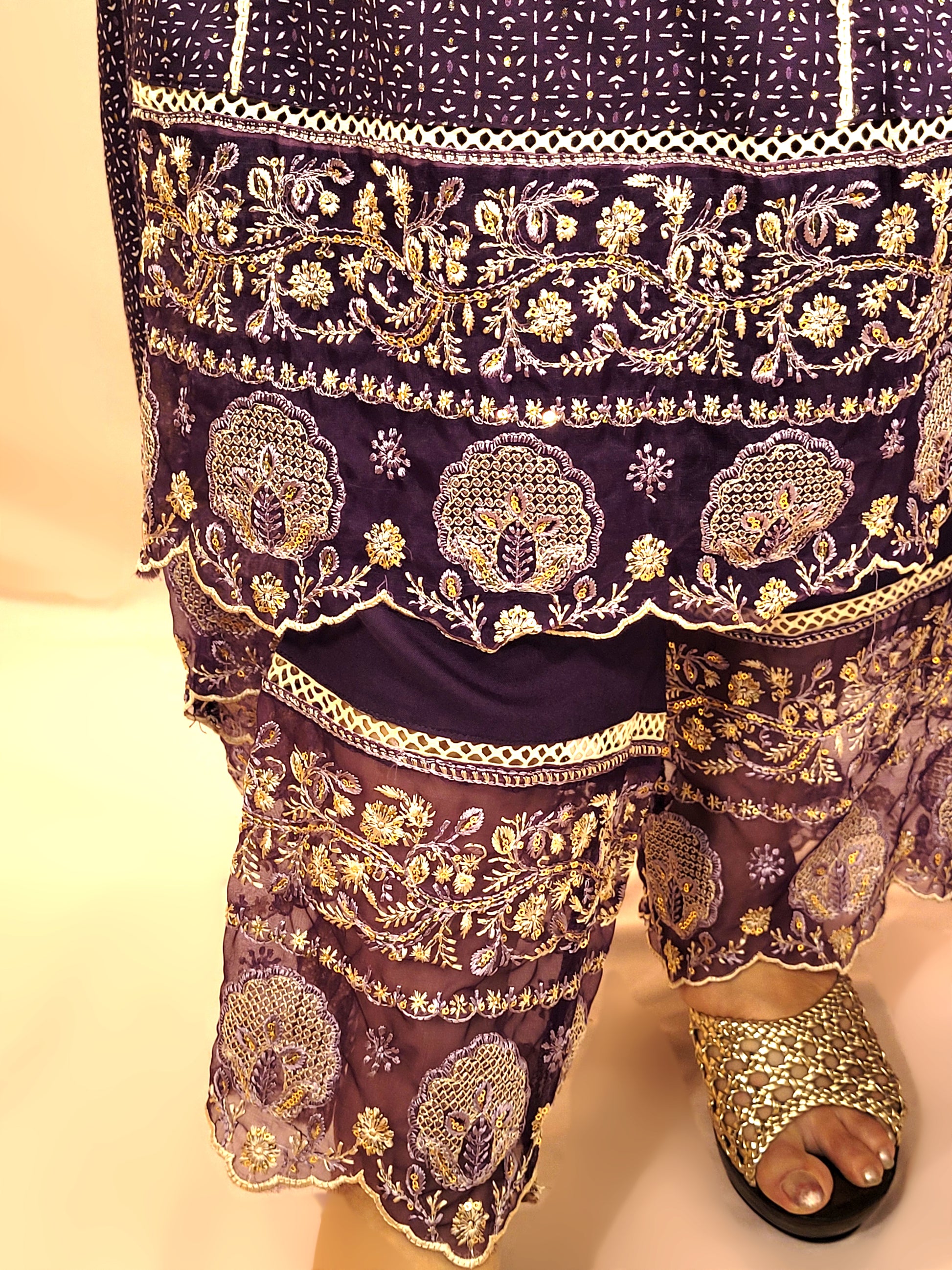 Rayon Purple Anarkali with Pant and Dupatta. Printed Base. Resham and Lace Work with sequins and mirror highlights.