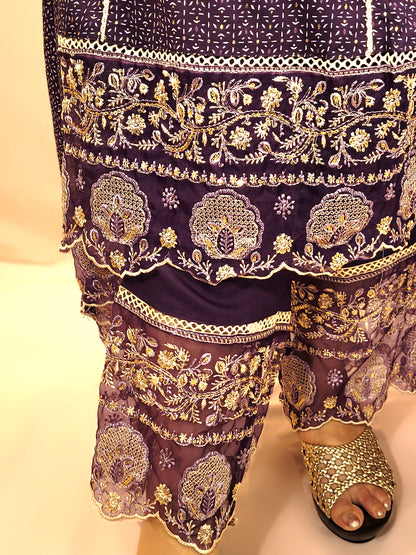 Rayon Purple Anarkali with Pant and Dupatta. Printed Base. Resham and Lace Work with sequins and mirror highlights.