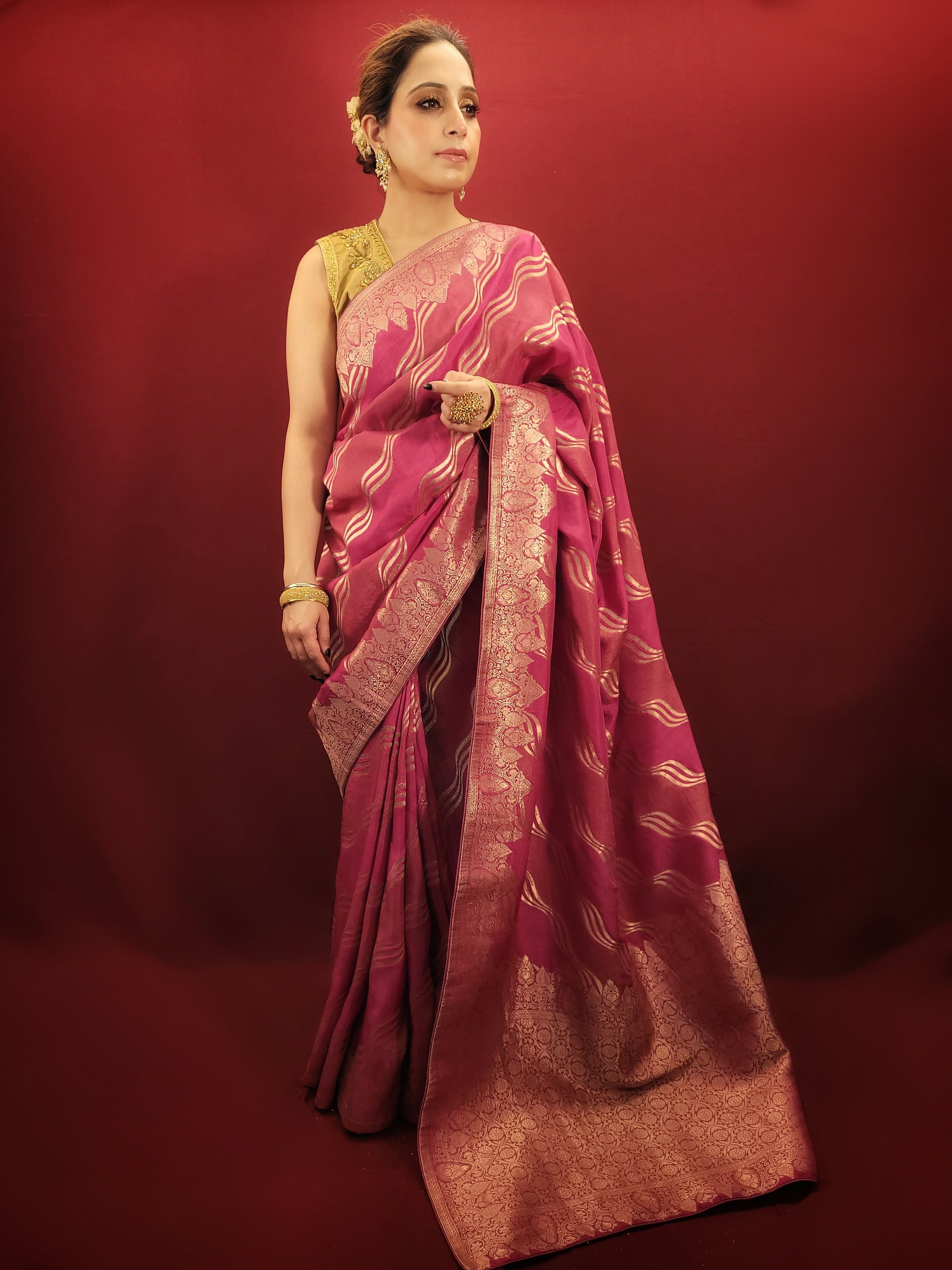This stunning hot pink woven silk saree blends elegance with flair. It is perfect for party and wedding occasions.