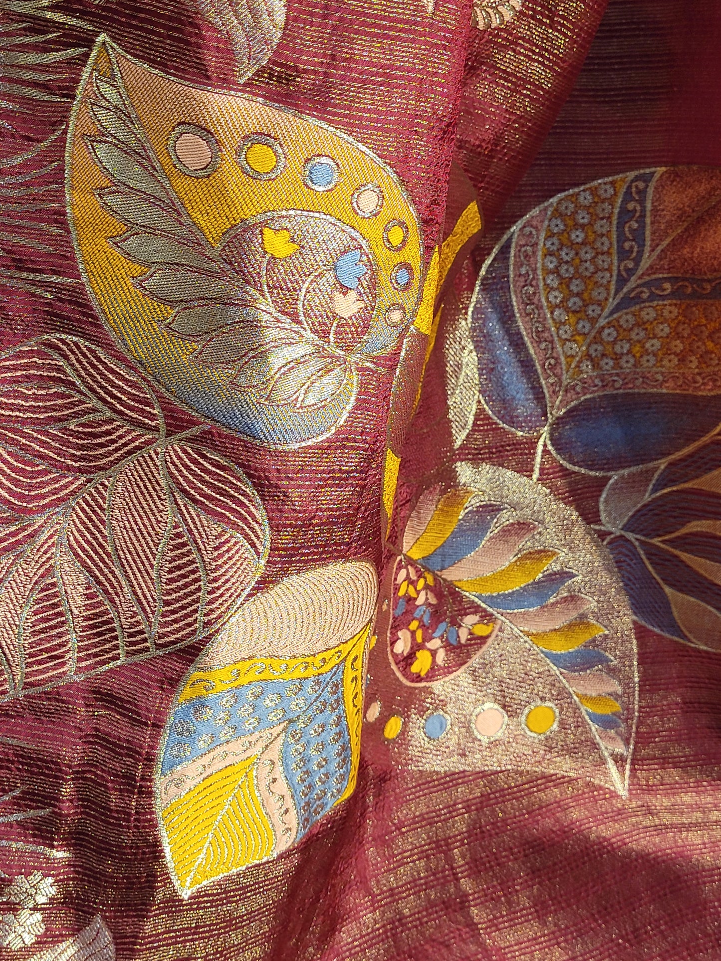 Rust Maroon Tissue Crepe Multicolor Weave Saree. Matching Unstitched Blouse Piece included.