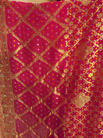 Rani Pink Georgette Banarasi (Khaddi) Bandhni Handwork Saree. Cutdana, Mirror and Sequins highlighting work. Matching unstitched blouse piece included.