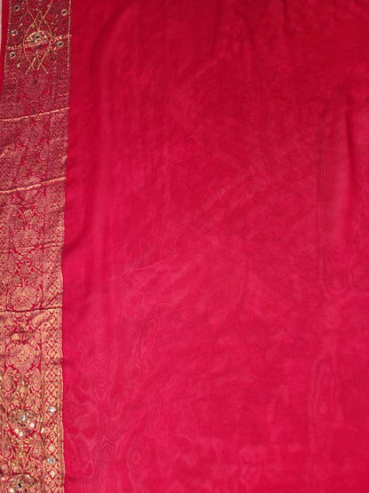 Rani Pink Georgette Banarasi (Khaddi) Bandhni Handwork Saree. Cutdana, Mirror and Sequins highlighting work. Matching unstitched blouse piece included.