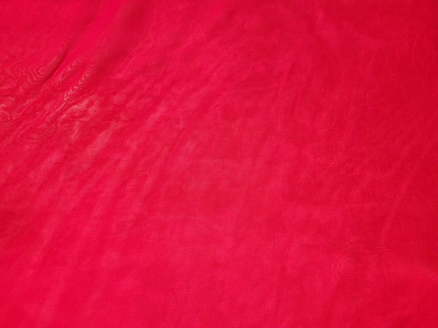 Rani Pink Georgette Banarasi (Khaddi) Bandhni Handwork Saree. Cutdana, Mirror and Sequins highlighting work. Matching unstitched blouse piece included.