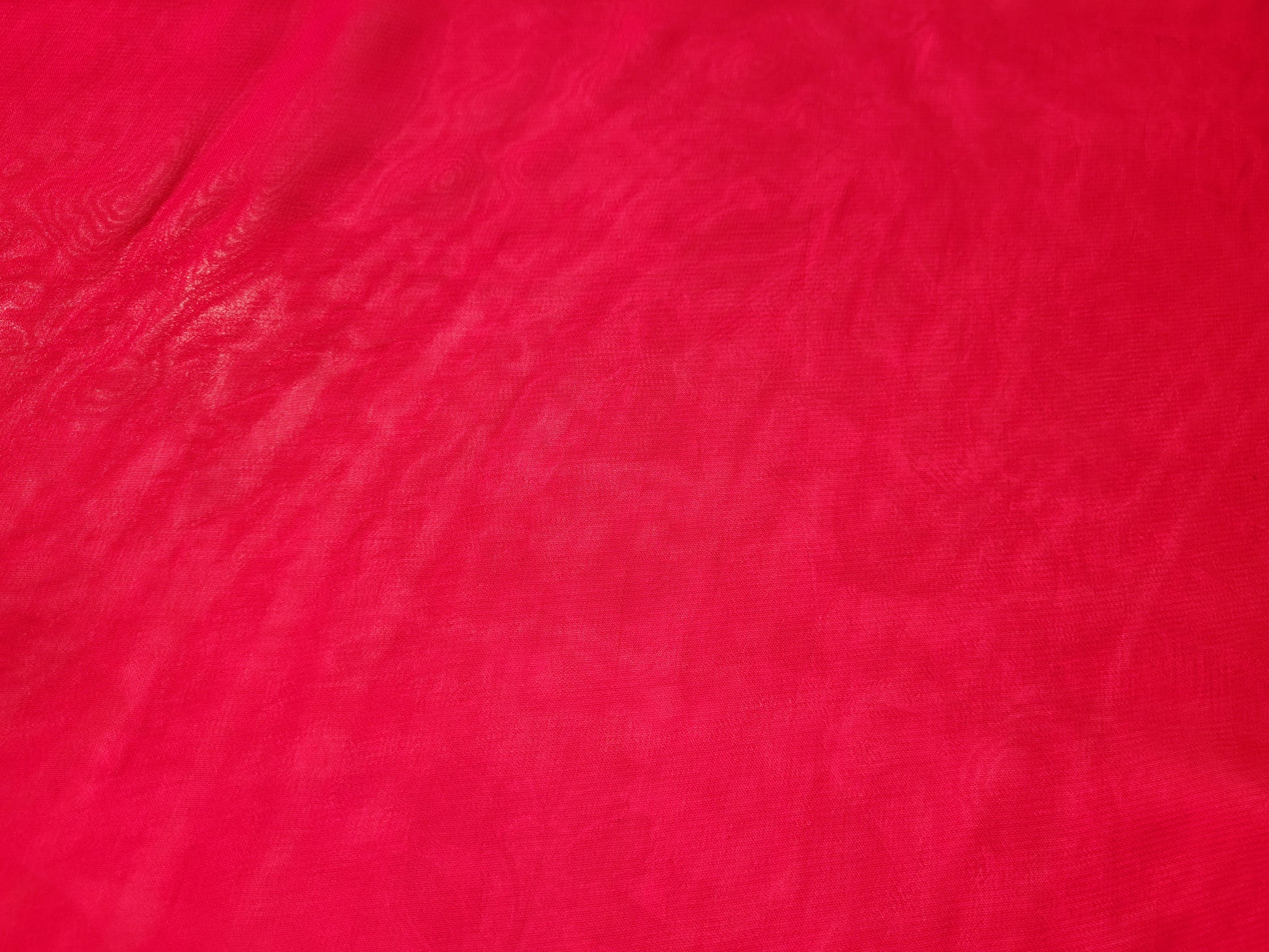 Rani Pink Georgette Banarasi (Khaddi) Bandhni Handwork Saree. Cutdana, Mirror and Sequins highlighting work. Matching unstitched blouse piece included.