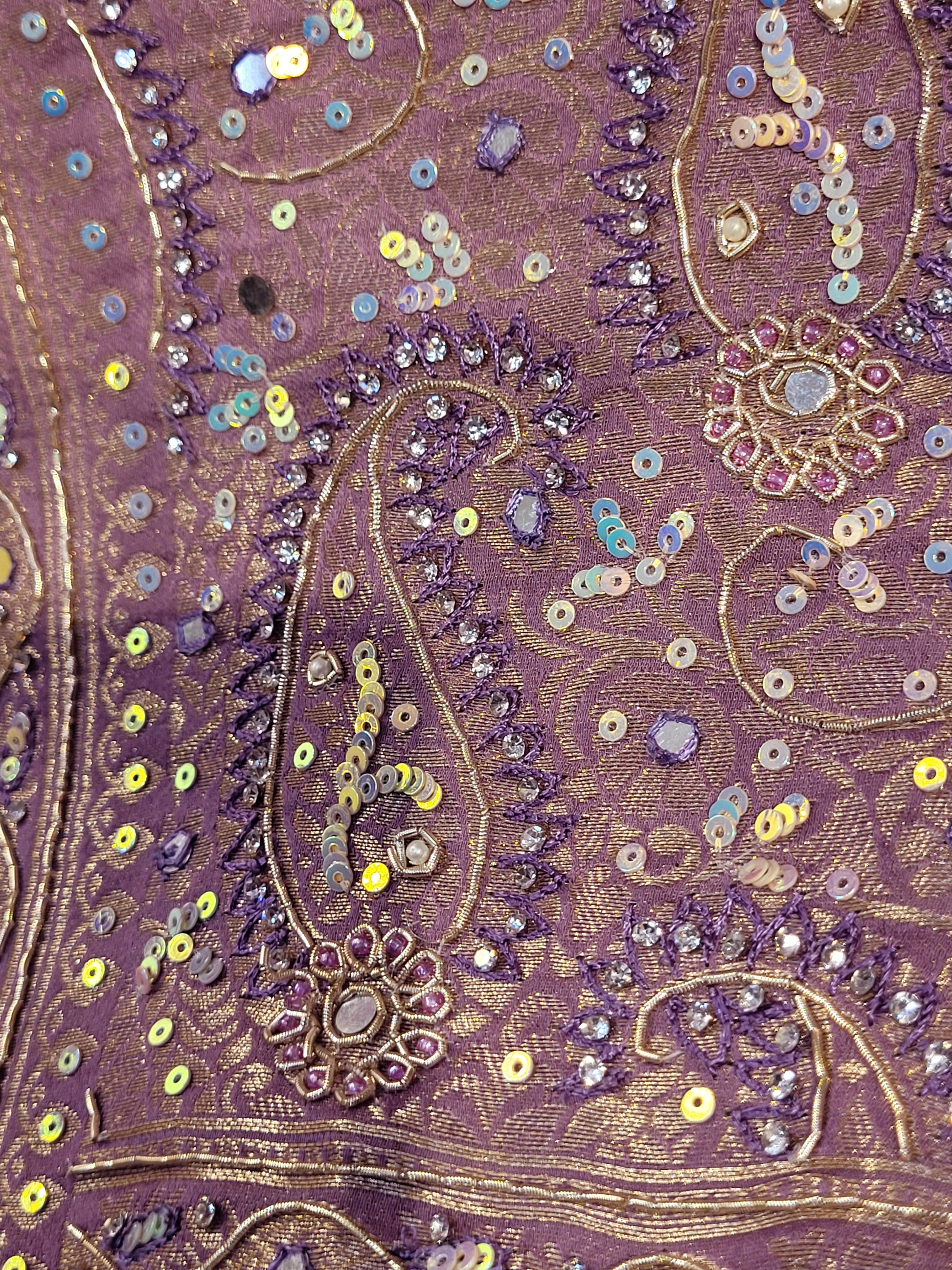 Shimmer Tissue Lavender Handwork Saree. Weaves highlighted with handwork using Dabka, Sequins, Mirror and Resham. Unstitched Blouse Piece included.