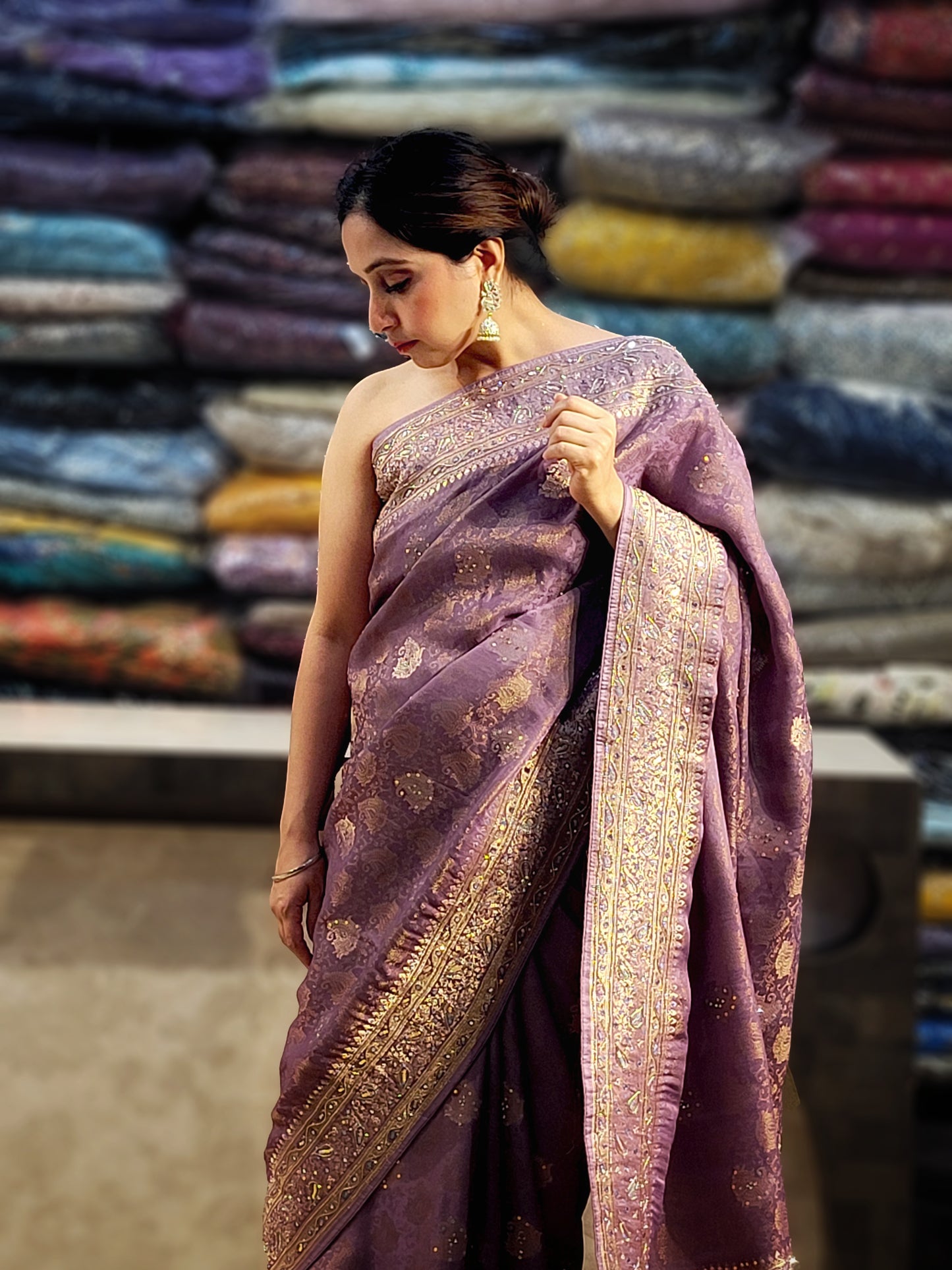 Shimmer Tissue Lavender Handwork Saree. Weaves highlighted with handwork using Dabka, Sequins, Mirror and Resham. Unstitched Blouse Piece included.