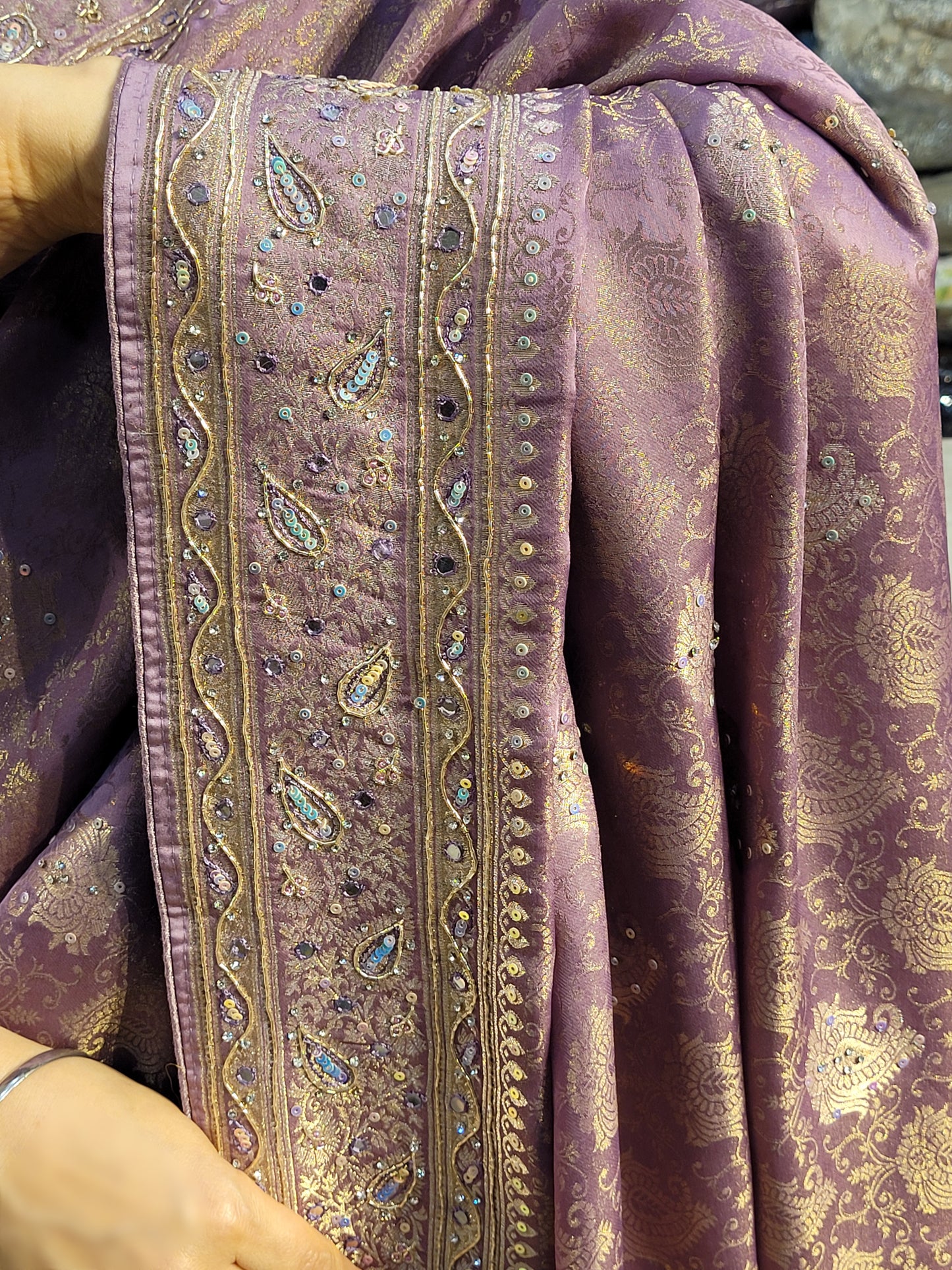 Shimmer Tissue Lavender Handwork Saree. Weaves highlighted with handwork using Dabka, Sequins, Mirror and Resham. Unstitched Blouse Piece included.