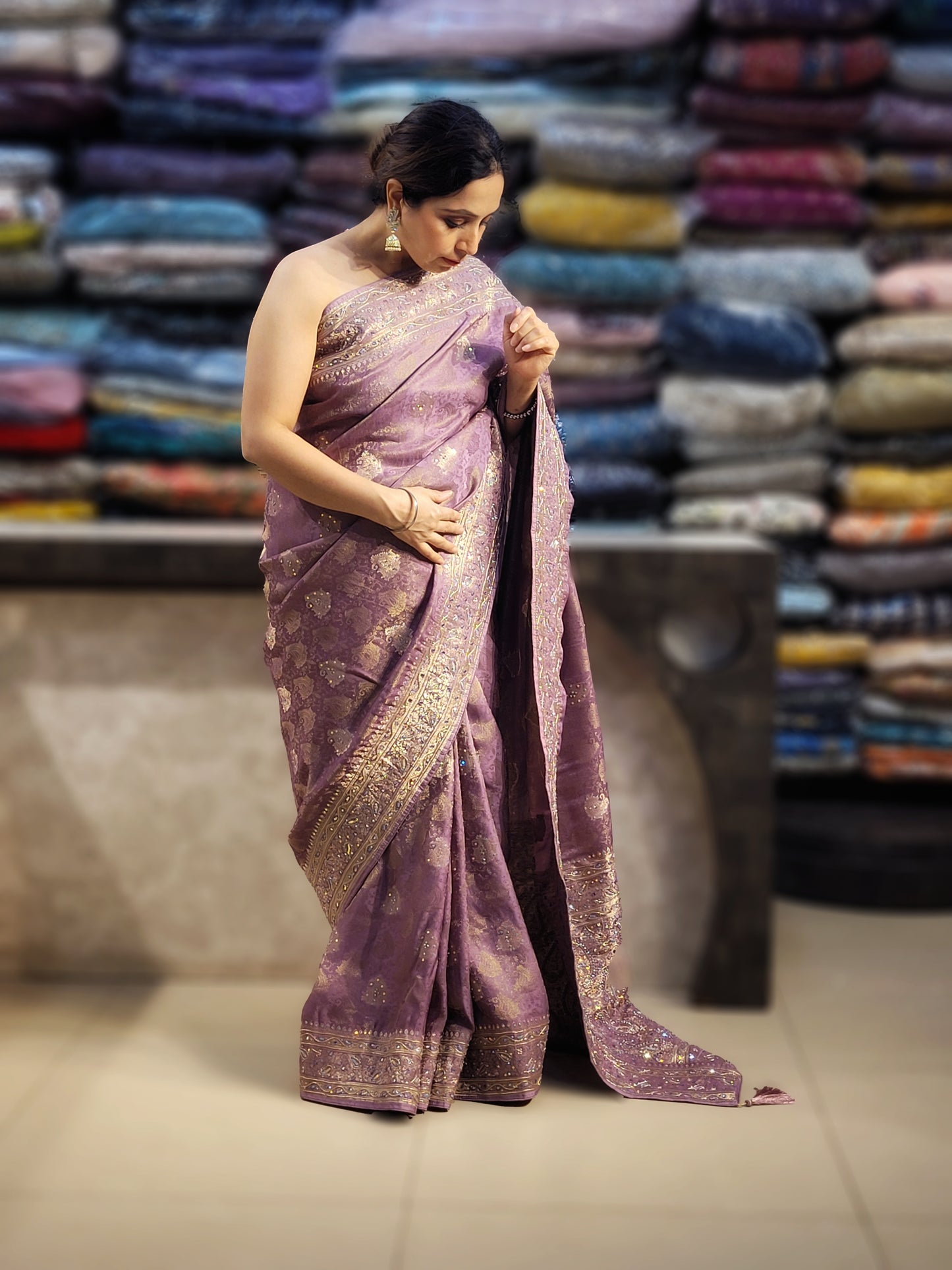 Shimmer Tissue Lavender Handwork Saree. Weaves highlighted with handwork using Dabka, Sequins, Mirror and Resham. Unstitched Blouse Piece included.