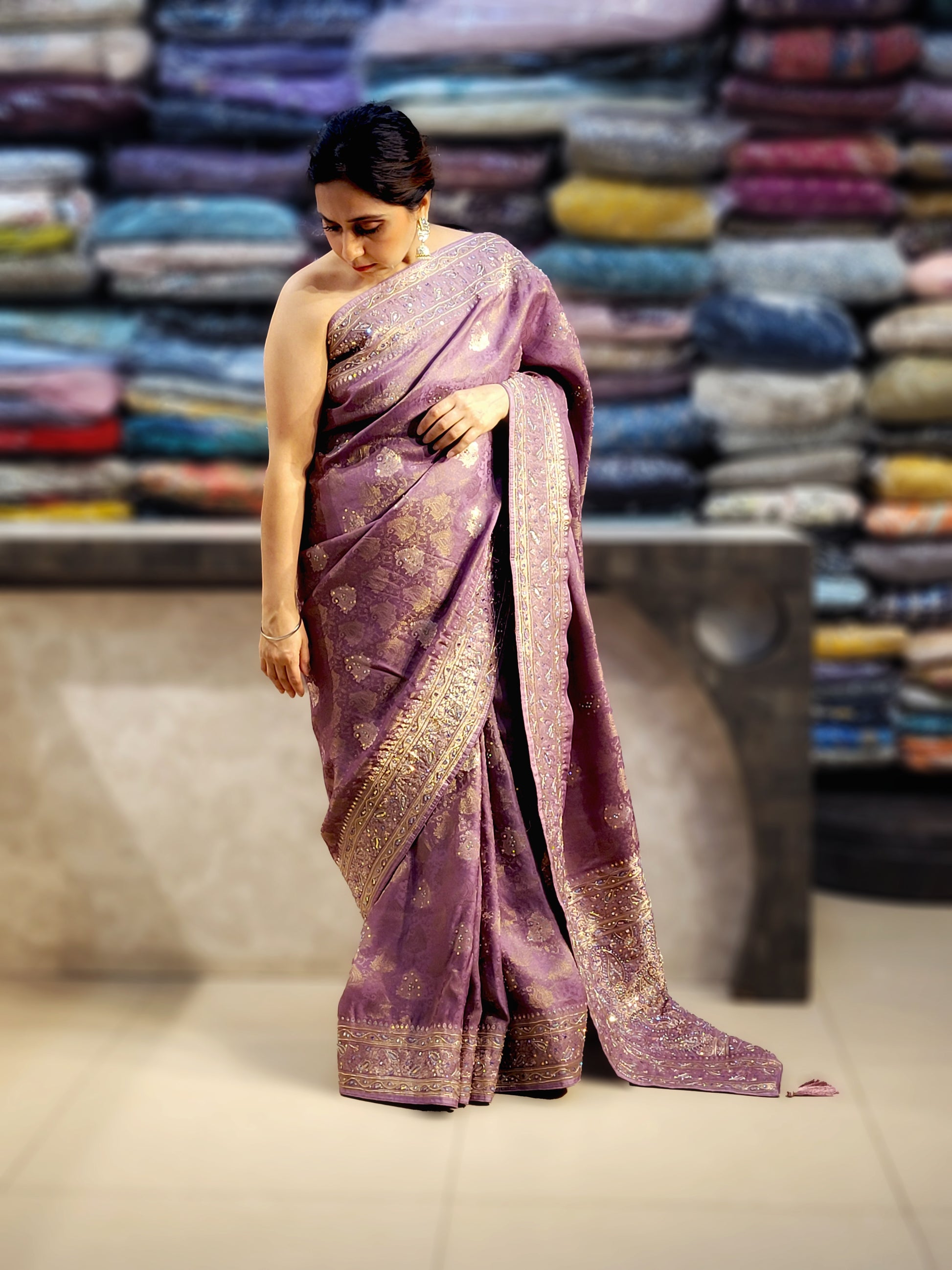 Shimmer Tissue Lavender Handwork Saree. Weaves highlighted with handwork using Dabka, Sequins, Mirror and Resham. Unstitched Blouse Piece included.