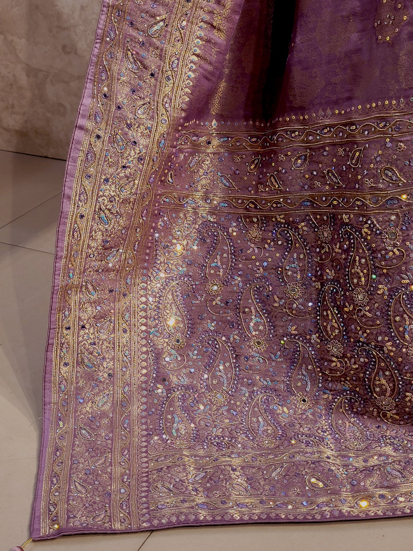 Shimmer Tissue Lavender Handwork Saree. Weaves highlighted with handwork using Dabka, Sequins, Mirror and Resham. Unstitched Blouse Piece included.