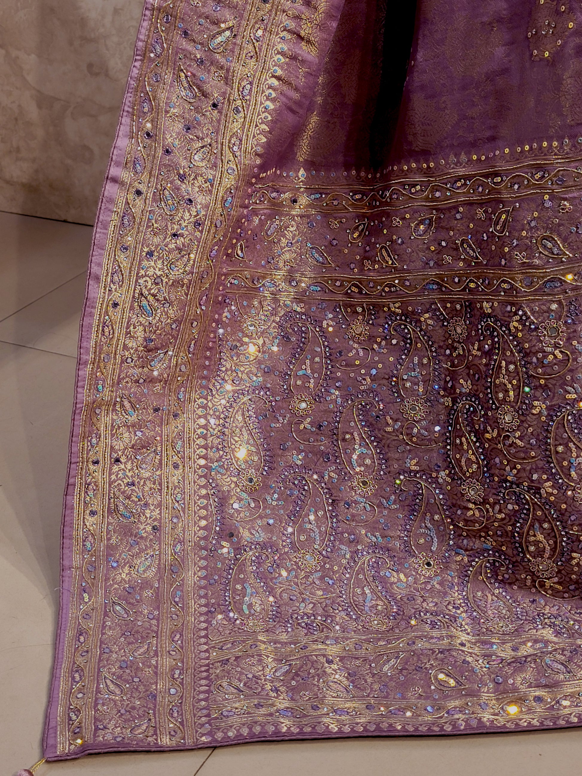 Shimmer Tissue Lavender Handwork Saree. Weaves highlighted with handwork using Dabka, Sequins, Mirror and Resham. Unstitched Blouse Piece included.