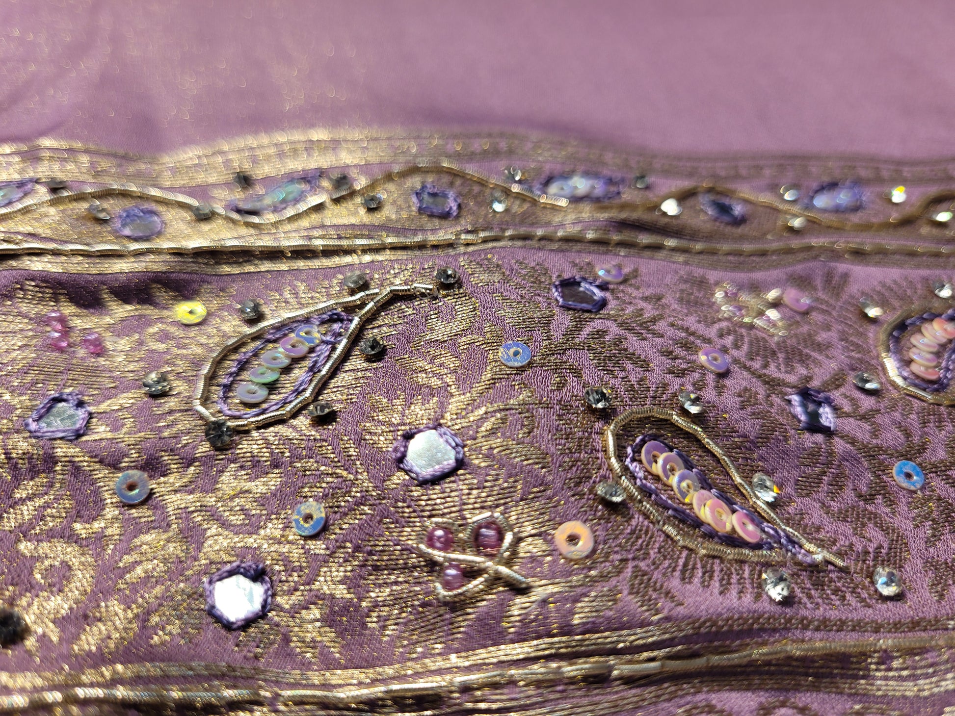 Shimmer Tissue Lavender Handwork Saree. Weaves highlighted with handwork using Dabka, Sequins, Mirror and Resham. Unstitched Blouse Piece included.