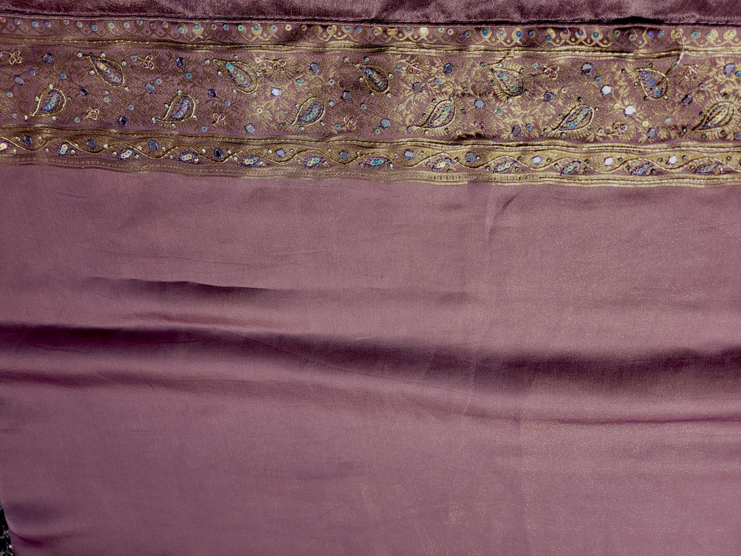 Shimmer Tissue Lavender Handwork Saree. Weaves highlighted with handwork using Dabka, Sequins, Mirror and Resham. Unstitched Blouse Piece included.