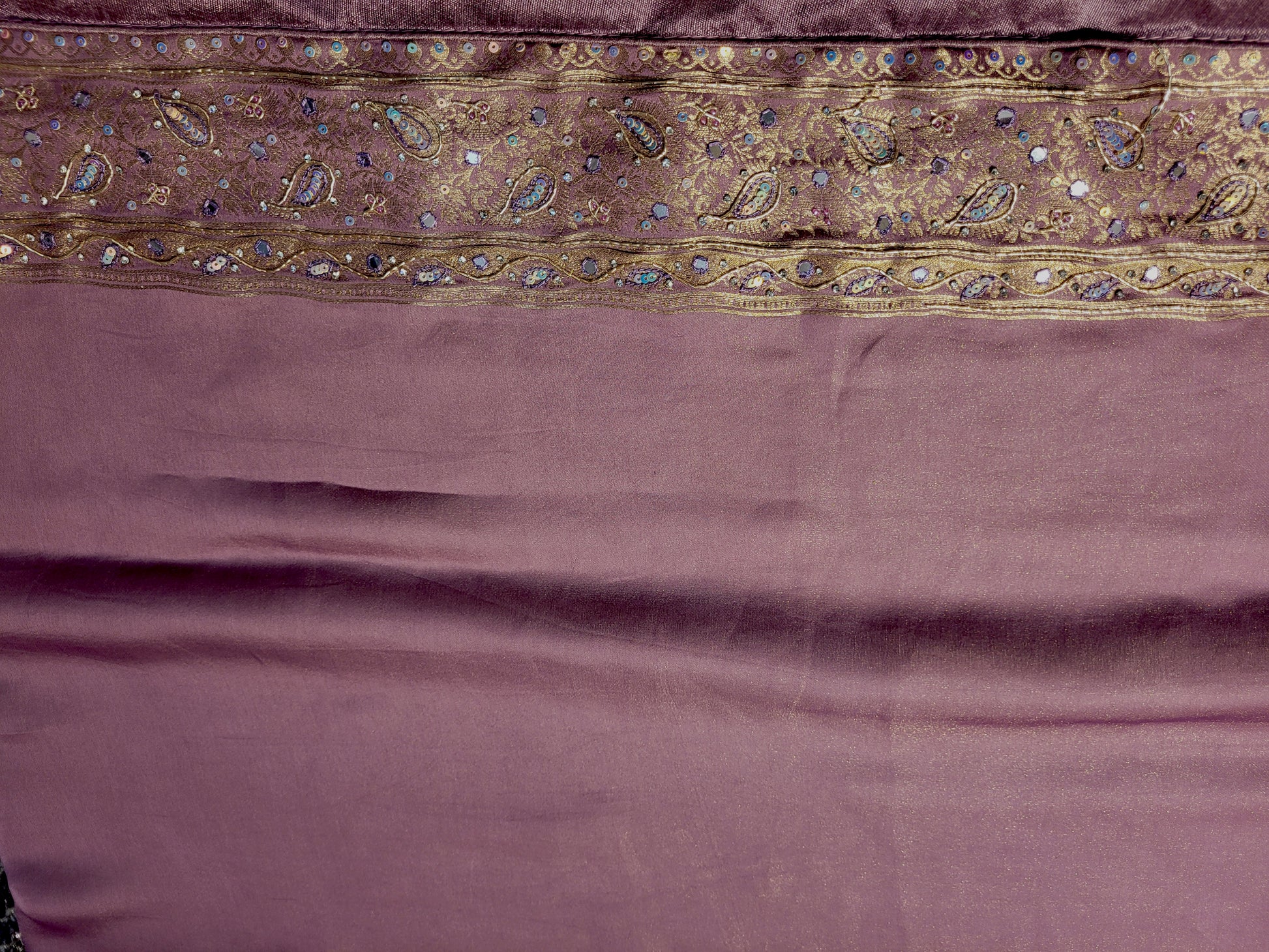 Shimmer Tissue Lavender Handwork Saree. Weaves highlighted with handwork using Dabka, Sequins, Mirror and Resham. Unstitched Blouse Piece included.