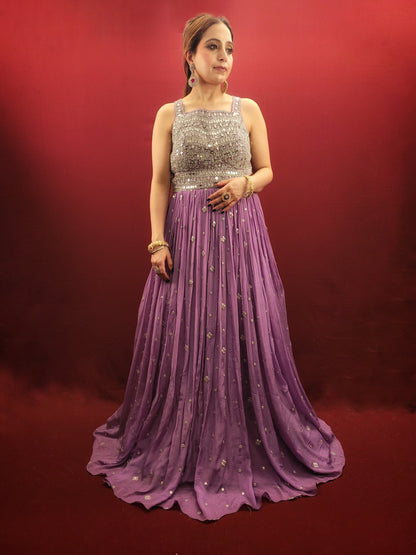 Step into the spotlight with a lavender indo-western gown, featuring dazzling mirror work on delicate chinnon fabric, an enchanting choice for engagement, party, and reception wear.
