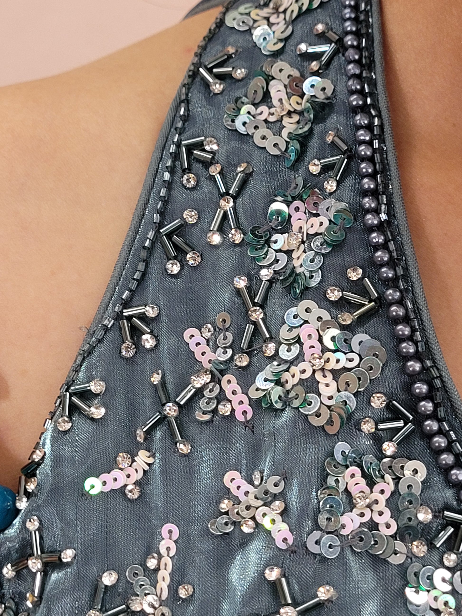 Elevate your ethnic wardrobe with this stunning Steel Blue Ready to Wear Drape Saree, crafted from luxurious Jimmy Choo fabric. This exquisite saree features a fish cut mermaid style skirt that beautifully accentuates your silhouette, flowing into a flared hem for a dramatic effect. The ensemble is completed with a hand work blouse, intricately adorned with shimmering sequins and delicate beads, adding a touch of glamour to your look.