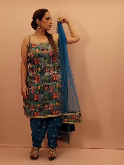 Fabric:&nbsp;Luxurious blue fabric with a vibrant Banarasi multicolor position weave on the kameez.
Kameez:&nbsp;Adorned with intricate Banarasi multicolor position weave, creating an enchanting tapestry of rich hues and patterns.
Pants:&nbsp;Matching embroidered tulip pants that add a modern twist to the classic silhouette.
Dupatta:&nbsp;Delicate net dupatta that drapes gracefully, adding an extra layer of sophistication.