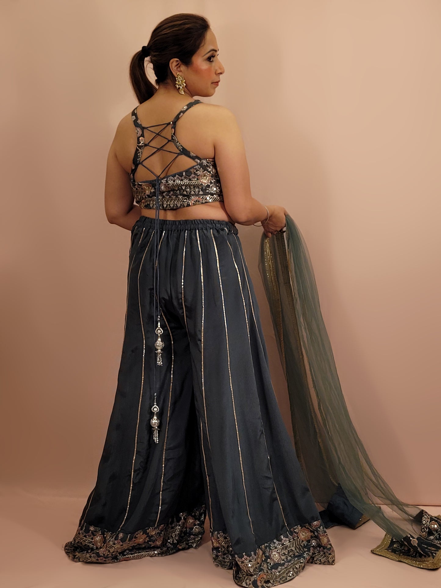 Elevate your ethnic wardrobe with this exquisite Cadet Blue Indo-Western Palazzo Dress. This stunning ensemble is perfect for any fashion-forward woman looking to make an impression at weddings, parties, or festive occasions.